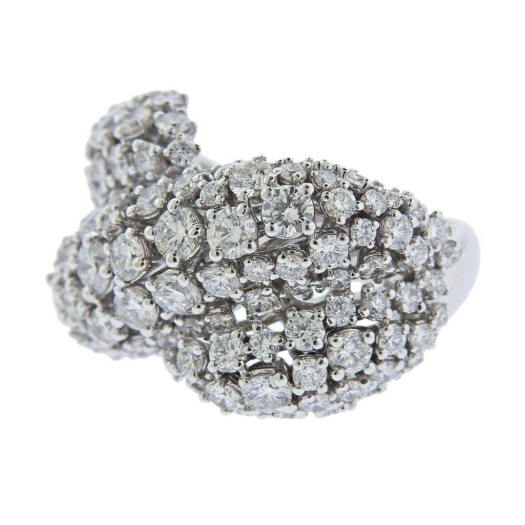 Impressive 18k white gold Italian-made cocktail ring with approx. 5.34ctw in G/VS diamonds. Ring size 7.25, Ring top is 17mm at widest point. Total weight 18.6 grams. Marked 750, Italian Mark. 