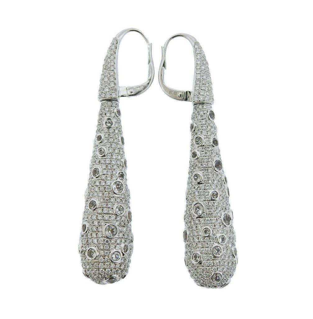 18k white gold Italian-made teardrop earrings, set with a total of 7.03ctw in FG/VS diamonds. Earrings measure 60mm long x 12mm at widest point. Total weight 22.9 grams. Marked 750, 18Kt, Italian mark, D7.03, P DD 7.03. 