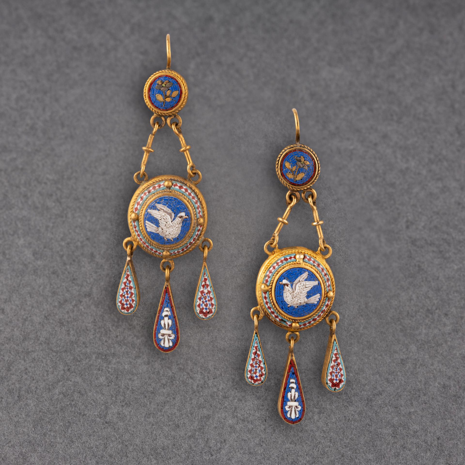 A very beautiful pair of antique earrings, italian made circa 1850.
Made in 18k gold and set with micro mosaïques.
Hallmarked.
Dimensions: 58mm height 22mm width
Weight: 9.50 grams