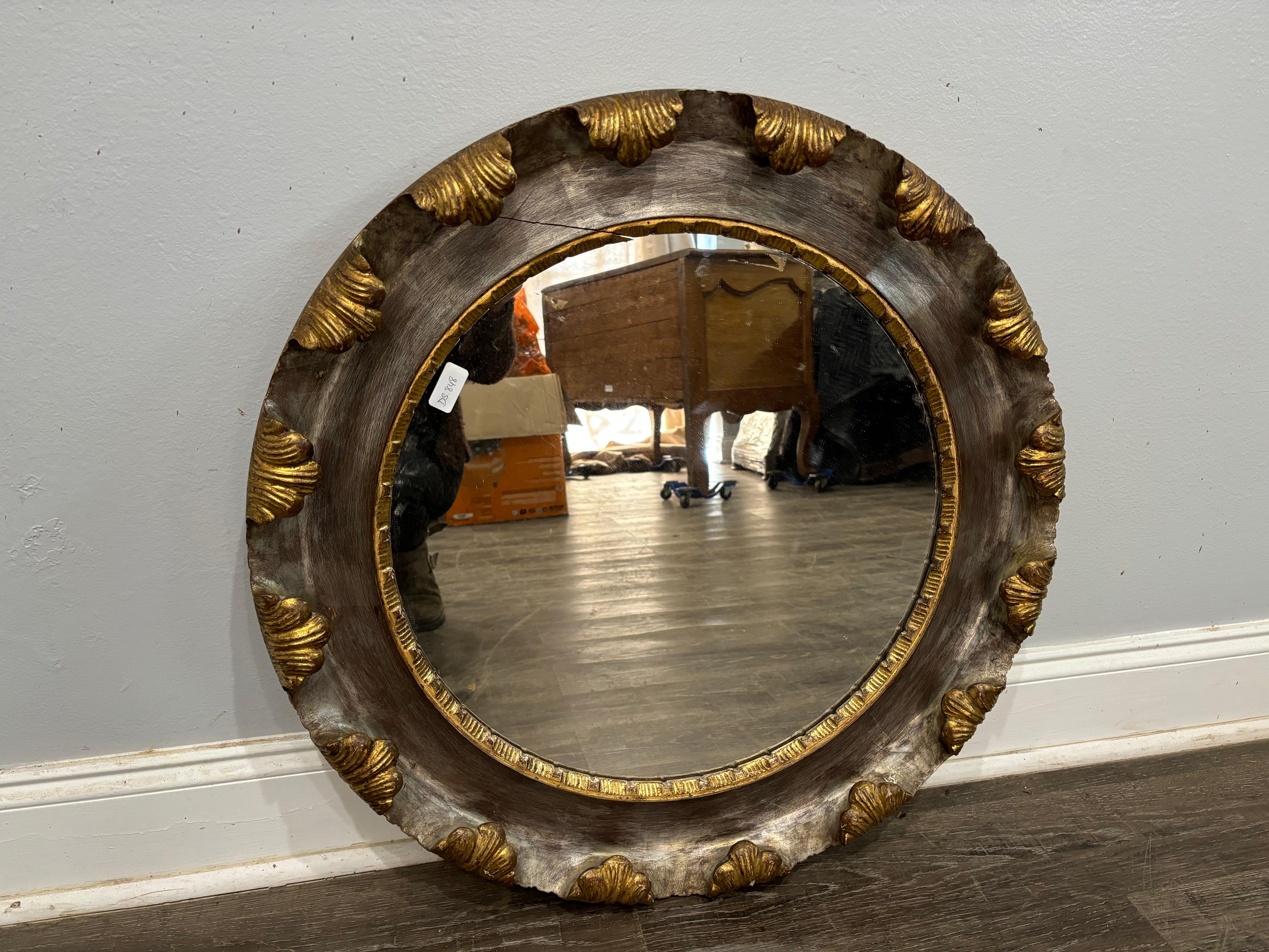 What a wonderful mirror with gold and silver color, this mirror is signed at the back.