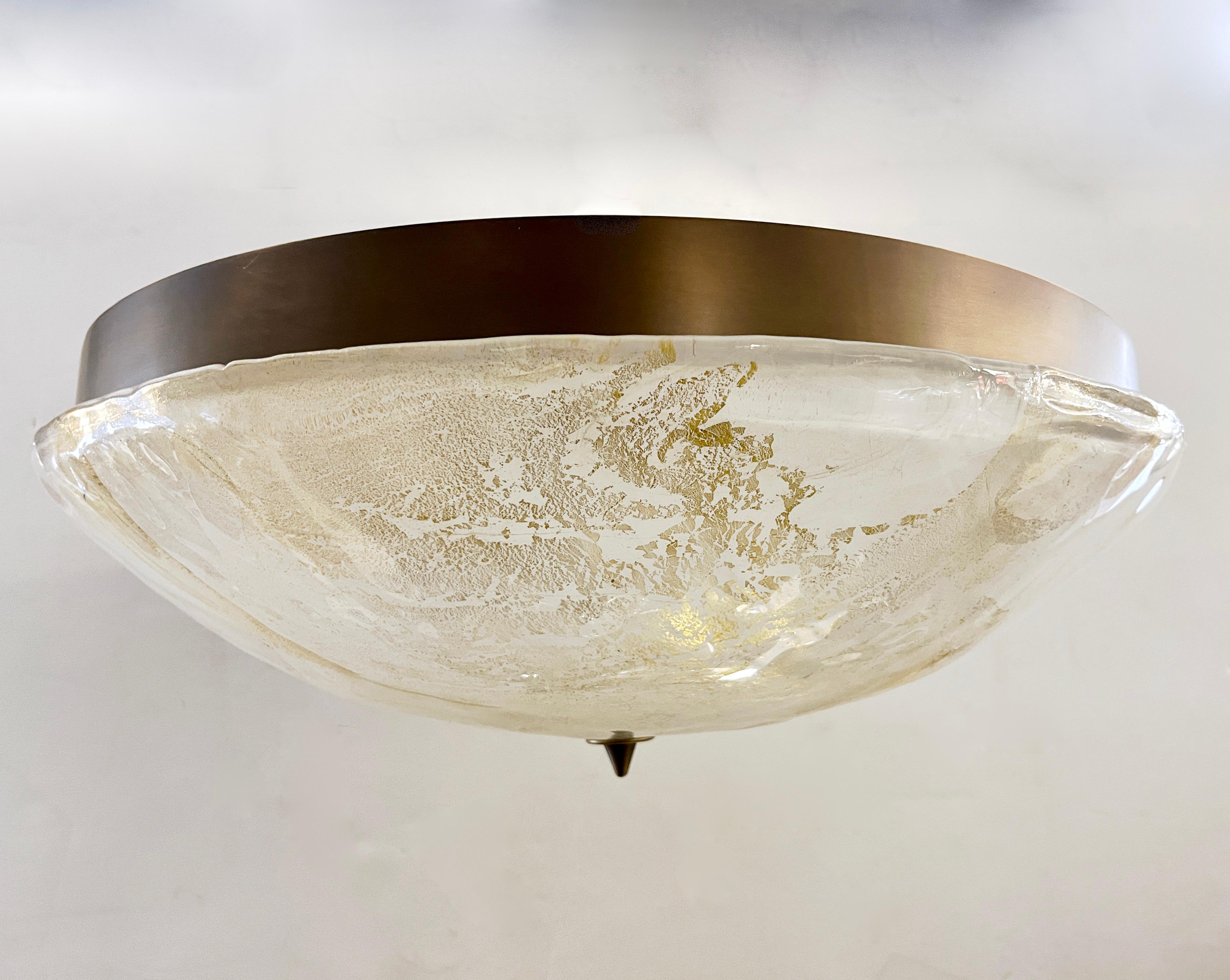 An Italian Mid-Century Modern style flush mount, entirely handcrafted in Italy, that can also be a pendant with pole and canopy, in crystal Murano glass, The overlaid frosted glass bowl, blown on the Murano island, has a smooth uneven organic