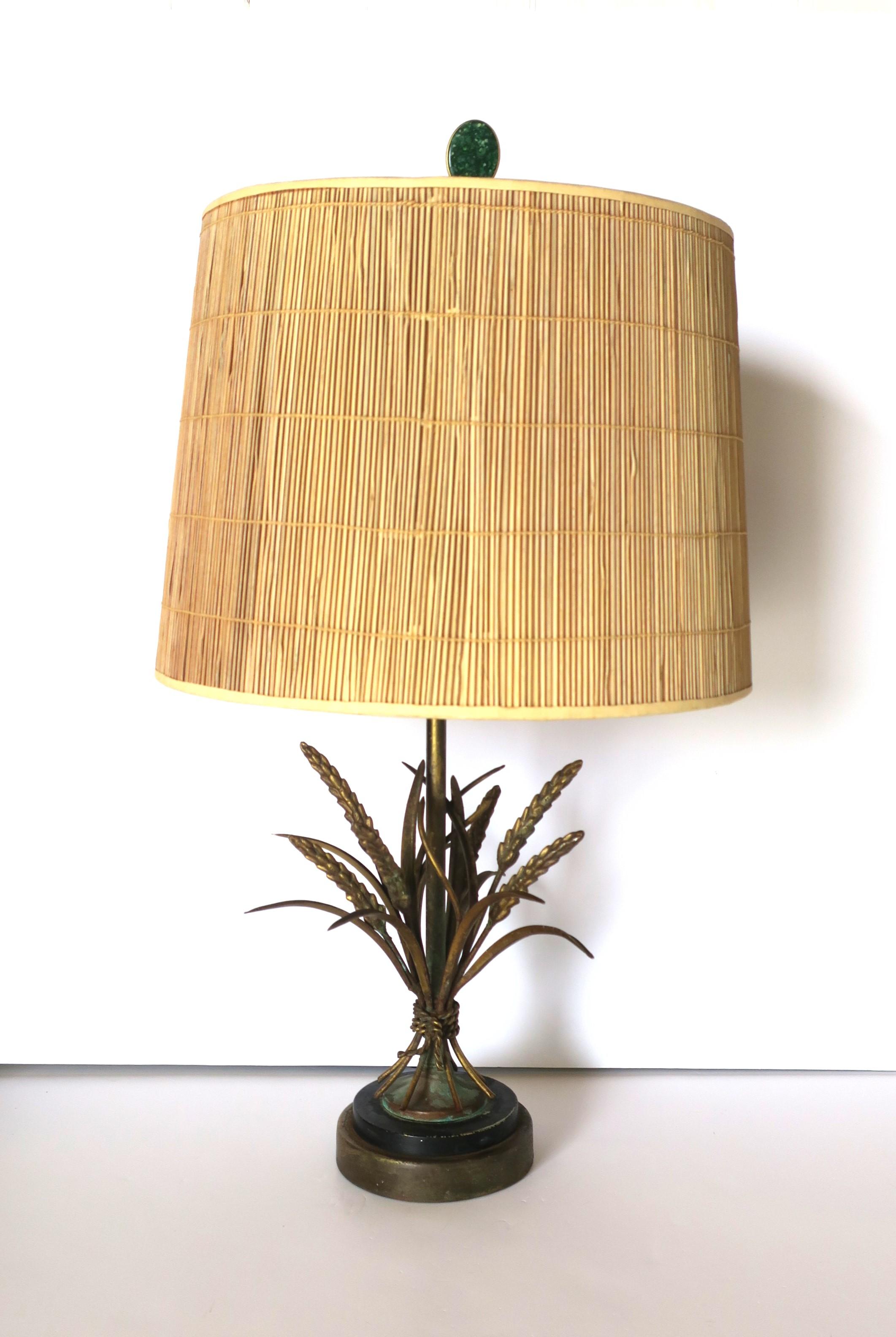 An Italian gold gilt brass Sheaf-of-Wheat desk or table lamp, in the style of design house Maison Baguès, circa early to mid-20th century, Italy. Lamp is a medium-size desk or table lamp with green stone and brass finial. 

Dimensions: 
25.5