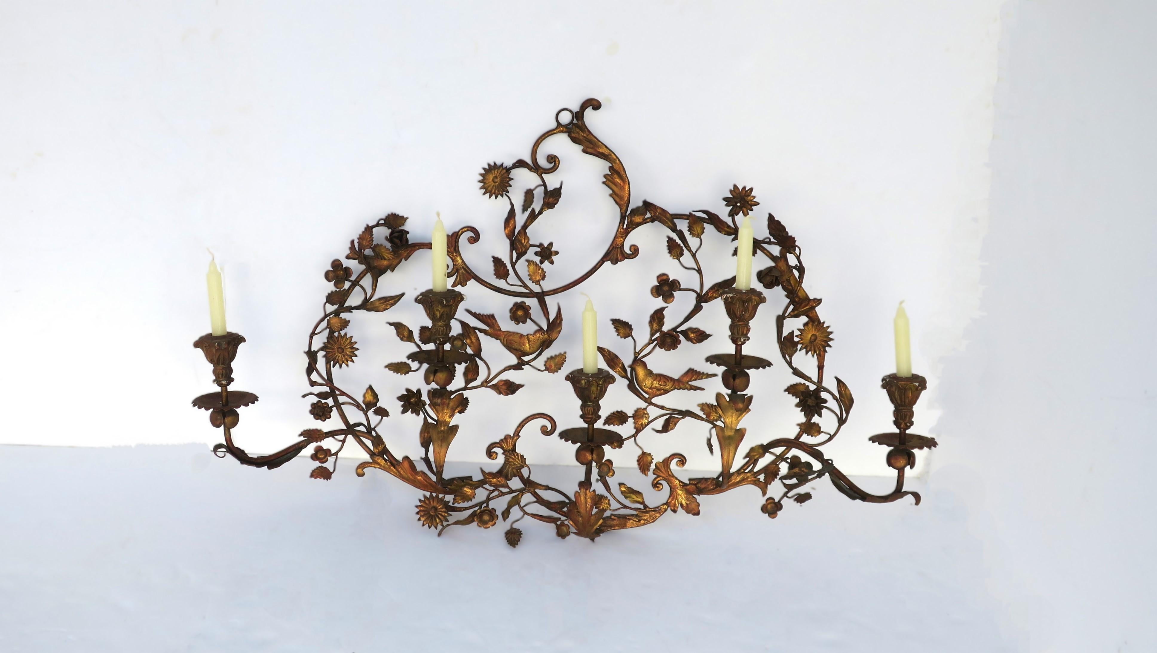 An Italian gold gilt tole metal wall candelabra with birds, flowers and leaves, in the Rococo style, circa early-20th century, Italy. A beautiful and relatively large-scale gold gilt tole metal wall relief of birds, flowers, and leaves, accompanied