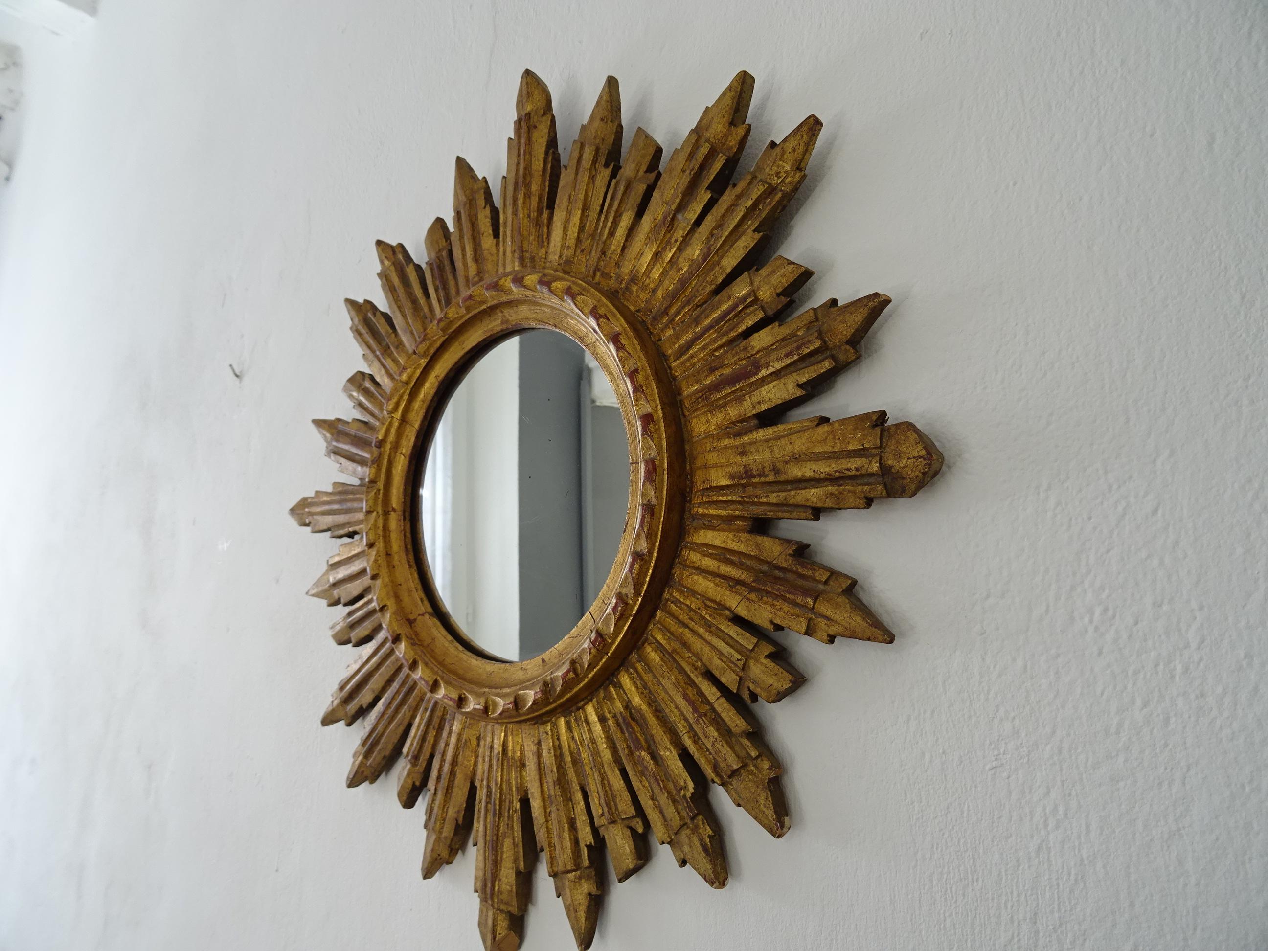 Beautiful Italian giltwood gold starburst. Mirror in perfect shape. Stamped 