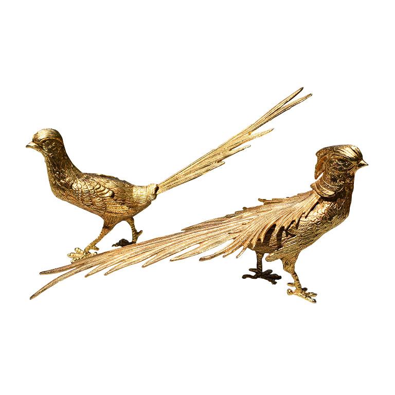 A grand pair of large gold-plated vermeil pheasant figurines. This set includes two bird statues or figurines, one female and one male. Each fowl is bronze and covered in gold plate or gold vermeil. Each bird has long intricately created feathers