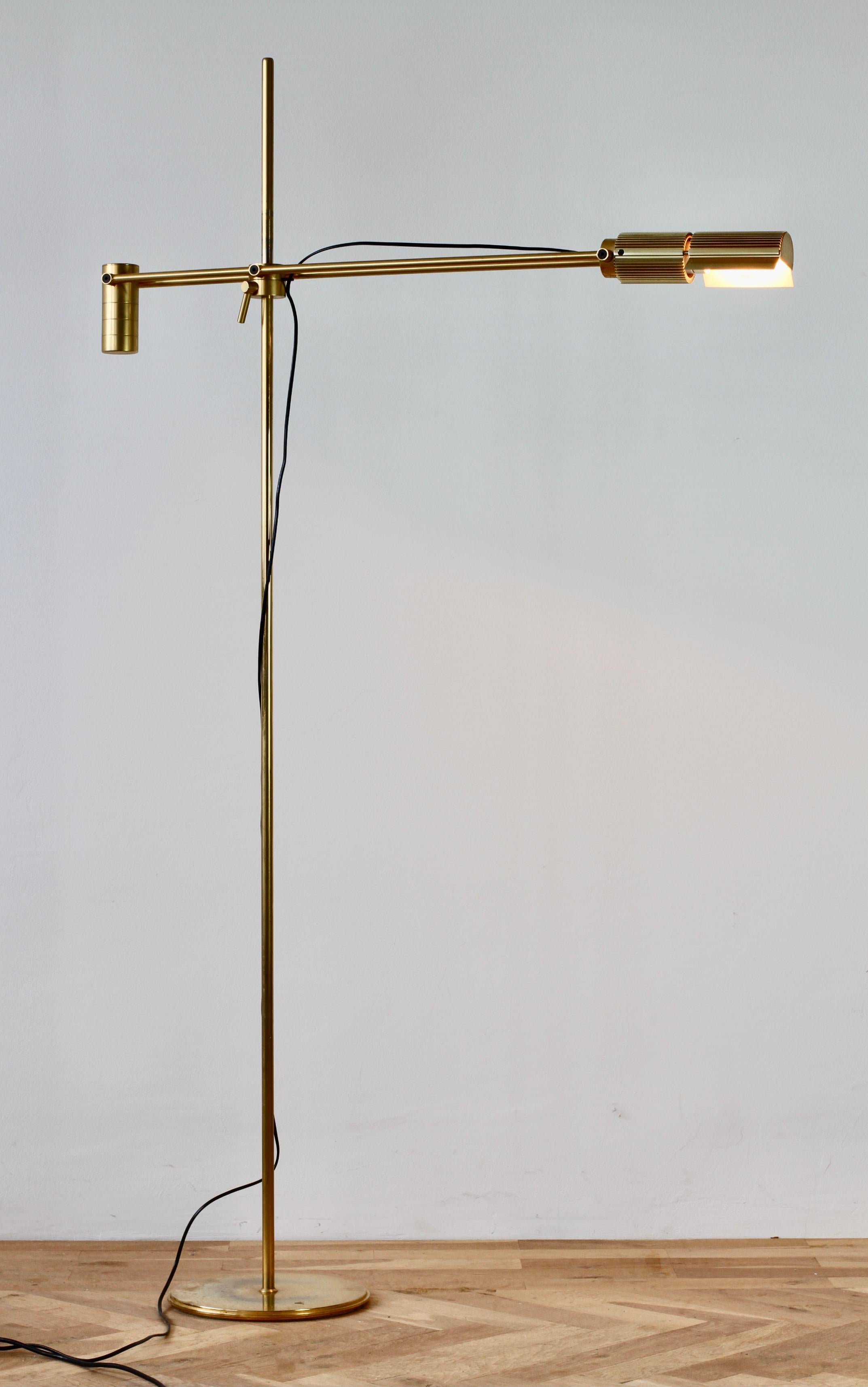 Rare Mid-Century Modern vintage Swiss made dimmable 'Haloprofil' floor lamp designed by Viktor Frauenknecht for Swiss Lamps International circa 1970s - early 1980s. Featuring gold plated brass (now with age related patina) and fully height