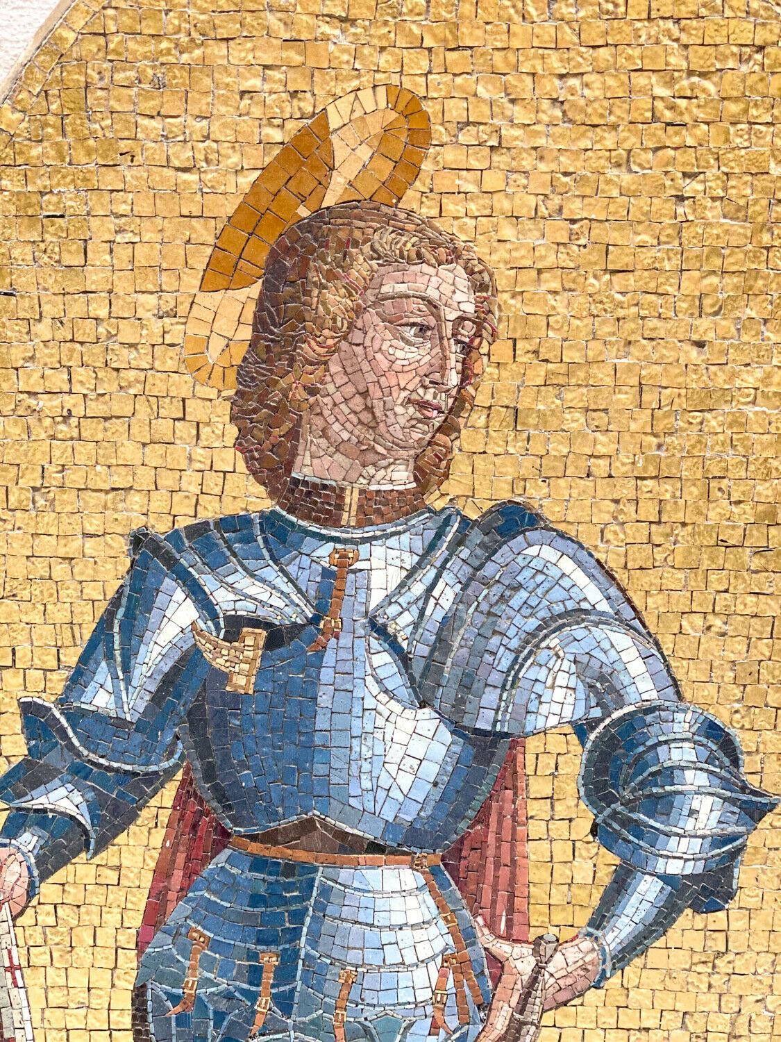 An incredible Italian gold tesserae glass mosaic depicting Saint Michael Slaying the Dragon. The background consisting of gold smalti tassarae mosaic tiles, various colored tiles used to expertly depict the archangel Michael and the dragon laying at