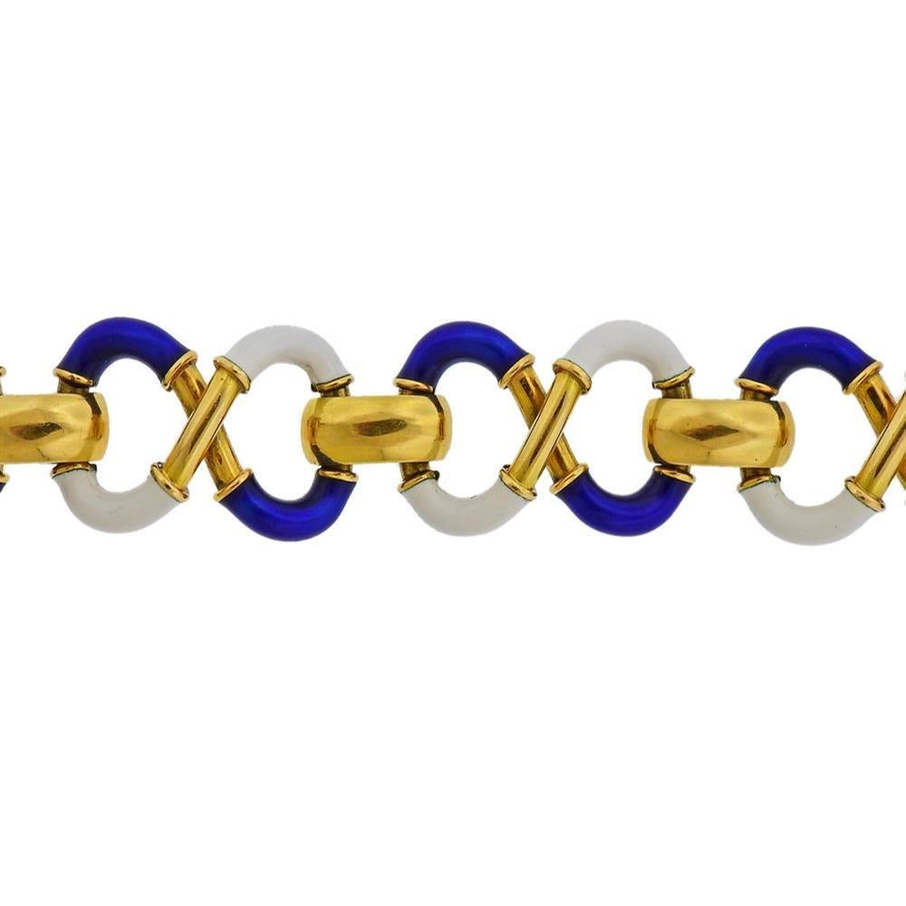 18k yellow gold Italian made bracelet, featuring infinity links in white and blue enamel. Bracelet is 7.25