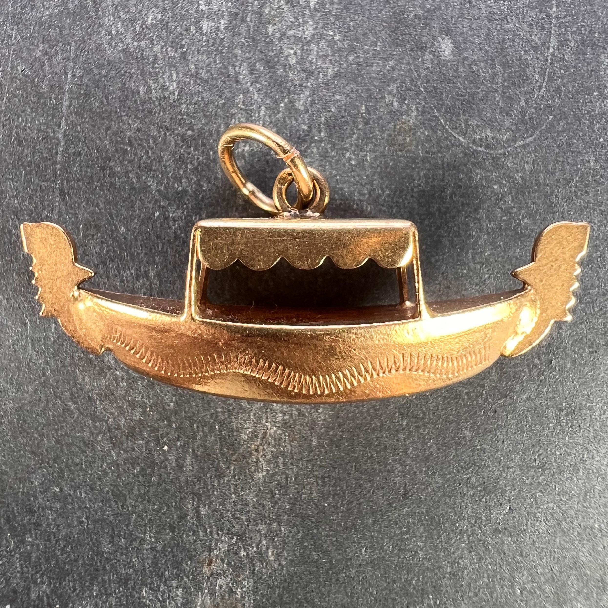 An Italian 18 karat (18K) yellow gold charm pendant designed as a gondola. Stamped with Italian marks for 18 karat gold to the jump ring along with French import marks for 18 karat gold.
 
Dimensions: 1.5 x 3.6 x 1 cm (not including jump