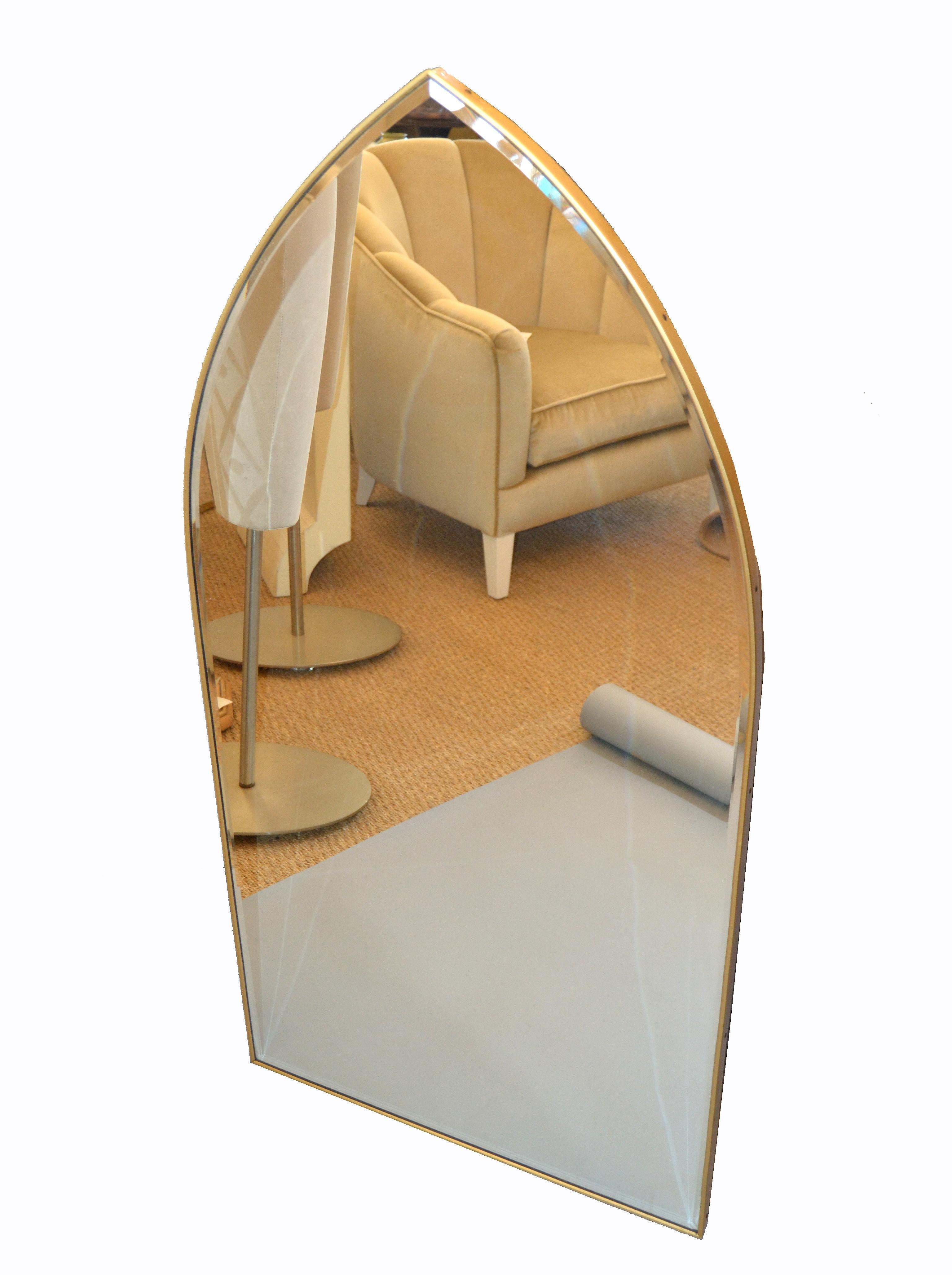 Large Hollywood Regency Gothic arch wall mirror from Italy.
The mirror is bevelled and framed with brass.
This stunning piece fits to any interior.