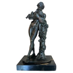 Estatua de bronce del siglo XIX de Sileno acunando al niño Dioniso