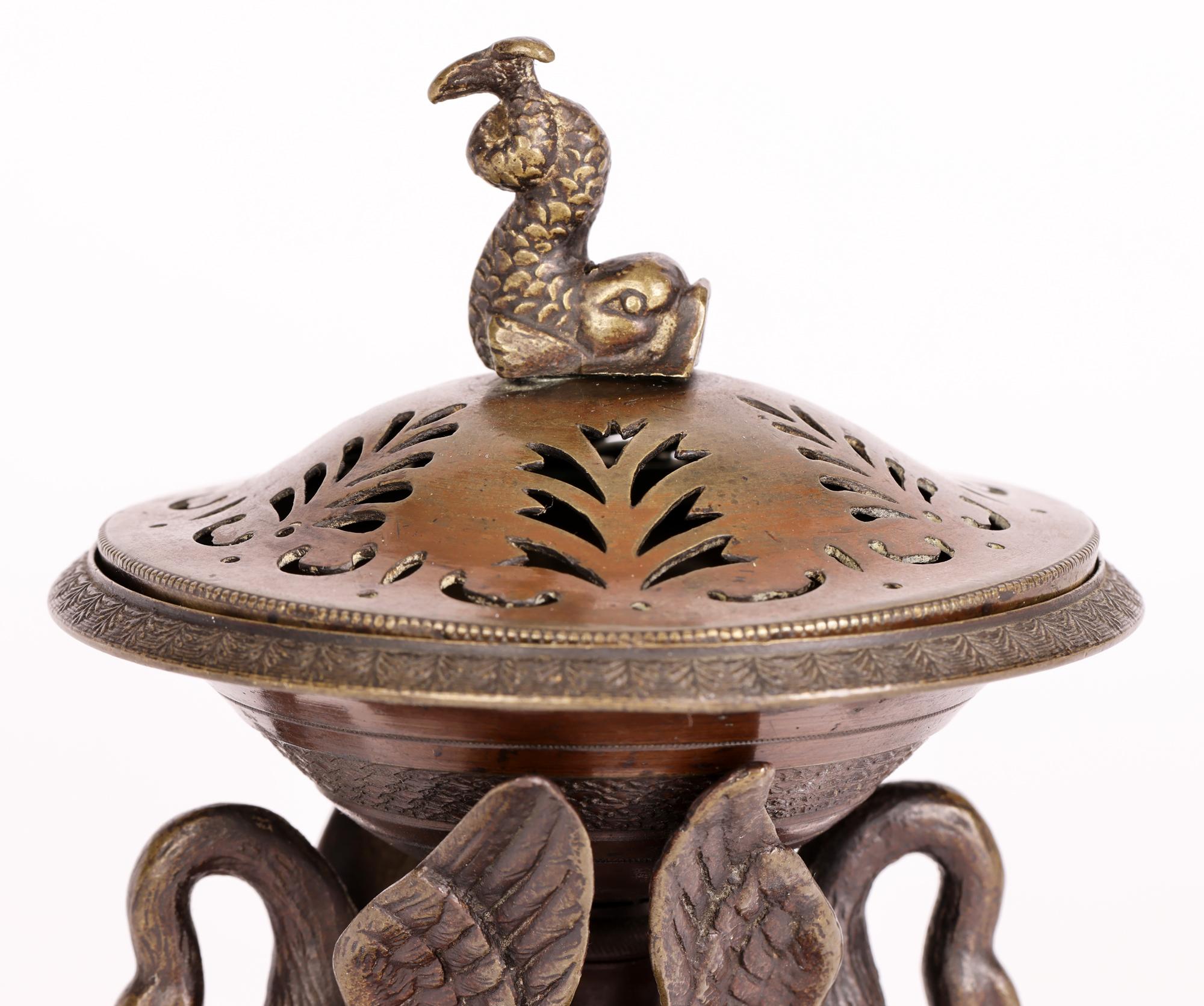 A very fine antique Italian attributed grand tour bronze lidded censer applied with birds dating from around 1860. The censer stands raised on a square base supported on four flat round corner feet. The central column support sits on a round based
