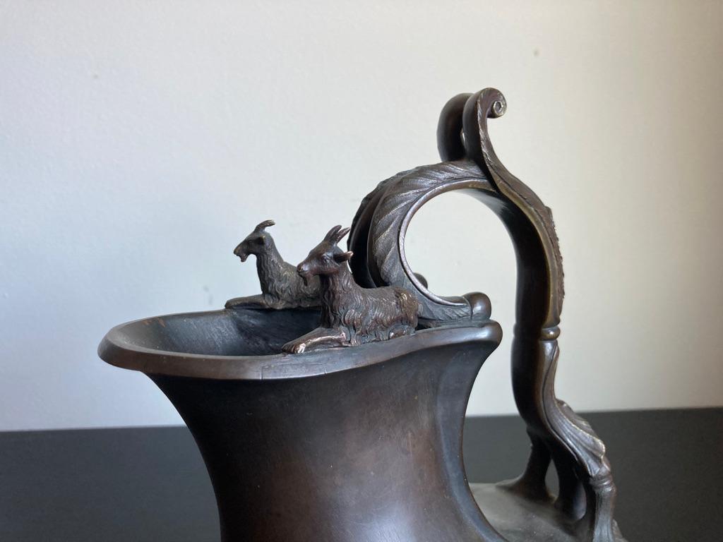 A finely cast 19th century Italian Grand Tour bronze ‘Askos’ ewer after the antique Roman original excavated at Herculaneum and now in the National Archaeological Museum, Naples. An Askos was a Roman pouring vessel for wine or milk, this one was