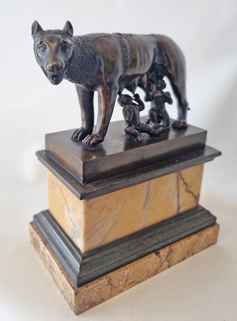 Antique grand tour patinated bronze model of the She Wolf feeding the twins Romulus and Remus who were to become the founders of the city of Rome, the 