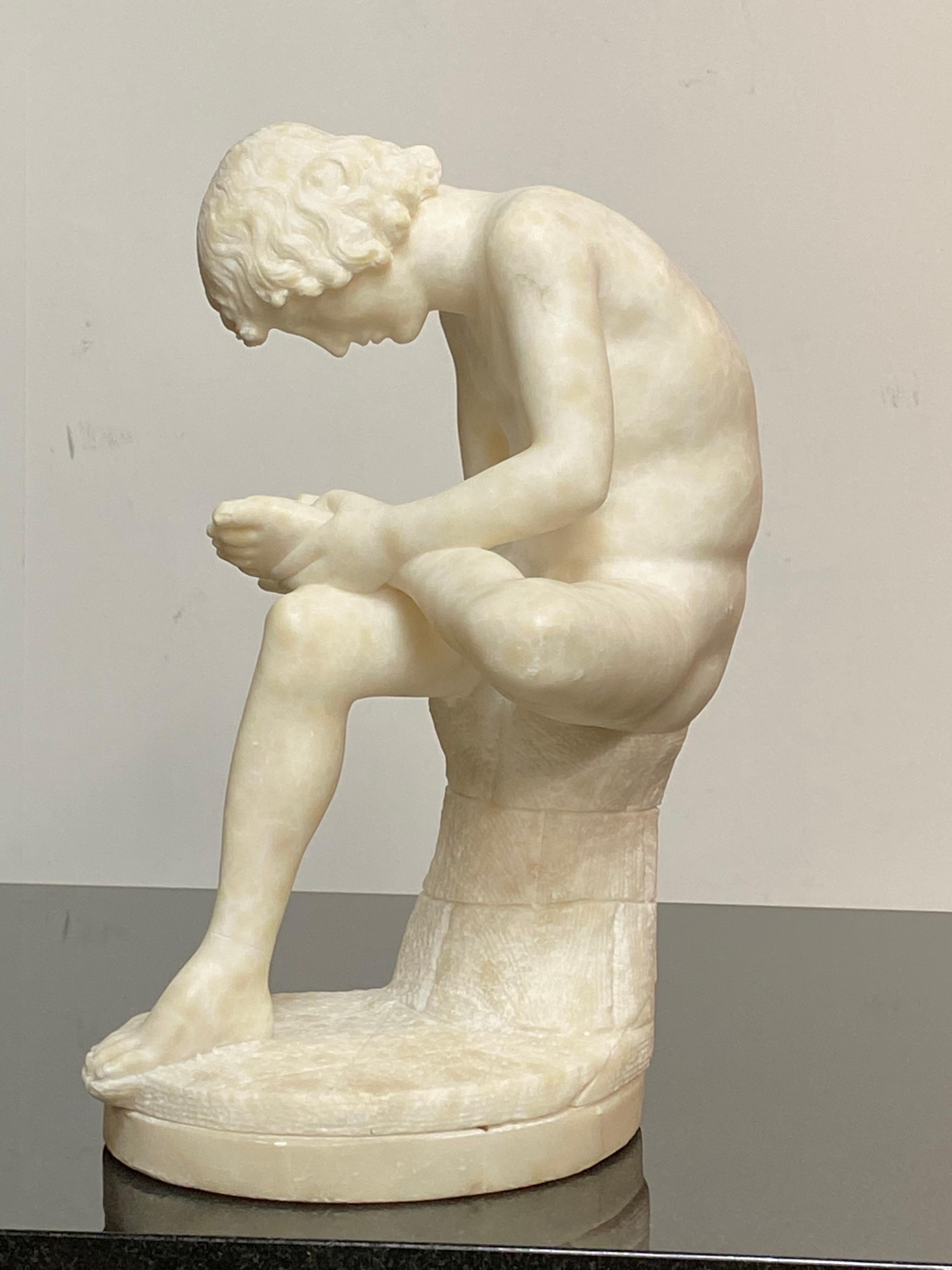 Mid-19th century tabletop size, masterfully carved, white alabaster figure of classical sculpture, known as either Fedele or Spinario.