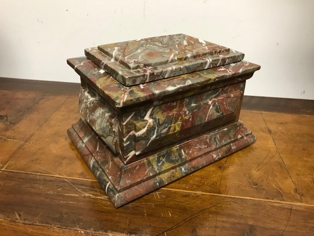 Hand carved marble desk top box of beautiful form and proportions. The sarcophagus form with raised geometric panels has a Palladian feel. Carved from a lovely piece of Breccia marble, with color ranging from deep red to rust to mustard as well as
