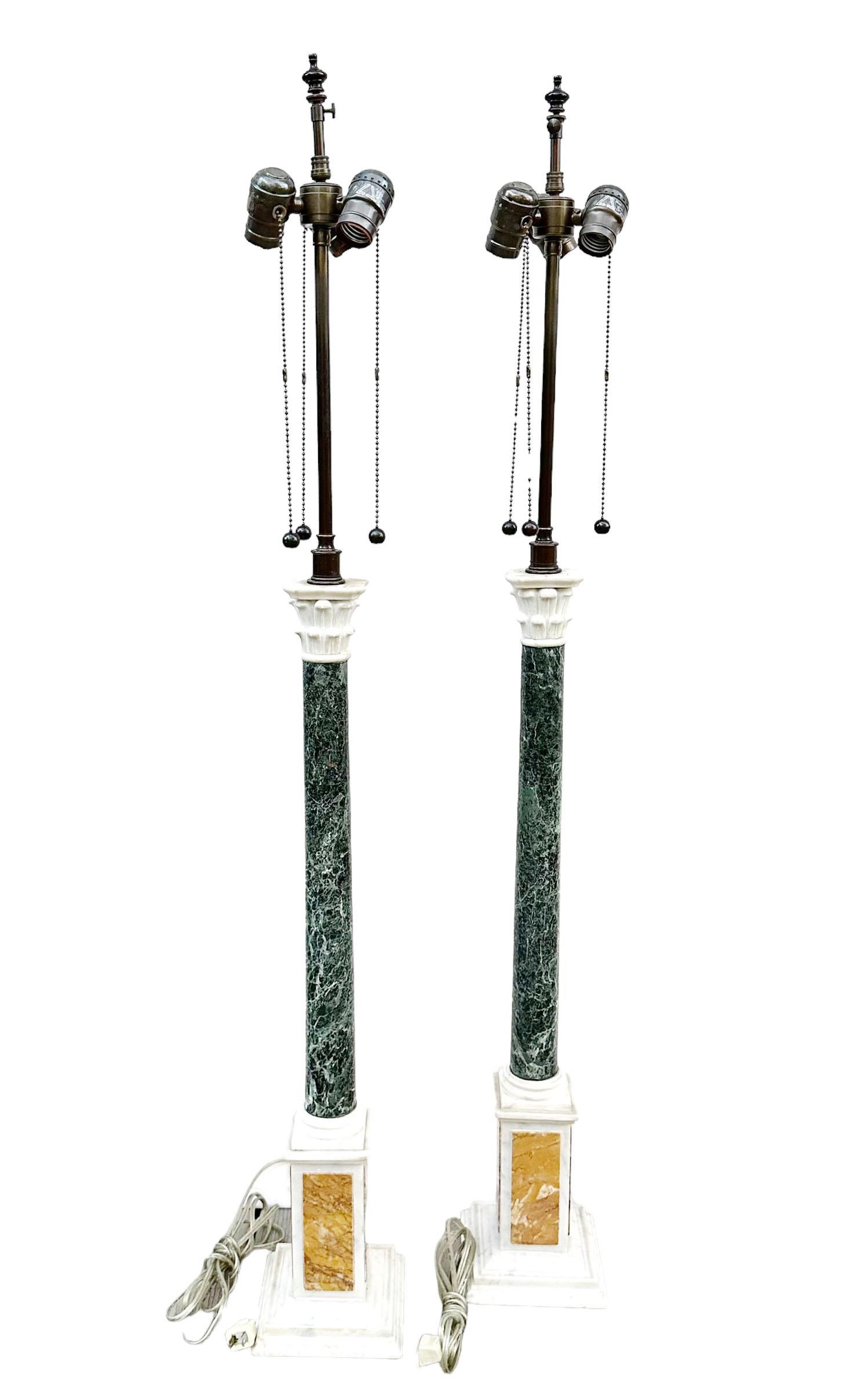 These fabulous early 19th century Italian lamps are grand tour columns for displaying objects at the very top. They have three specimens of marble and probably were electrified in the late sixties. These have been redone with three bob fixtures and