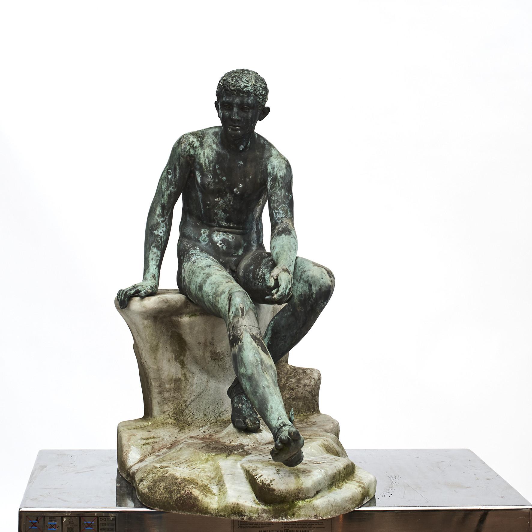 Italian Grand Tour bronze sculpture of the ‘Seated Hermes’ (Mercury), atop a naturalistically carved white marble base.
The original statue was found during the excavations of Herculaneum in 1758 and it is displayed today in the Archaeological