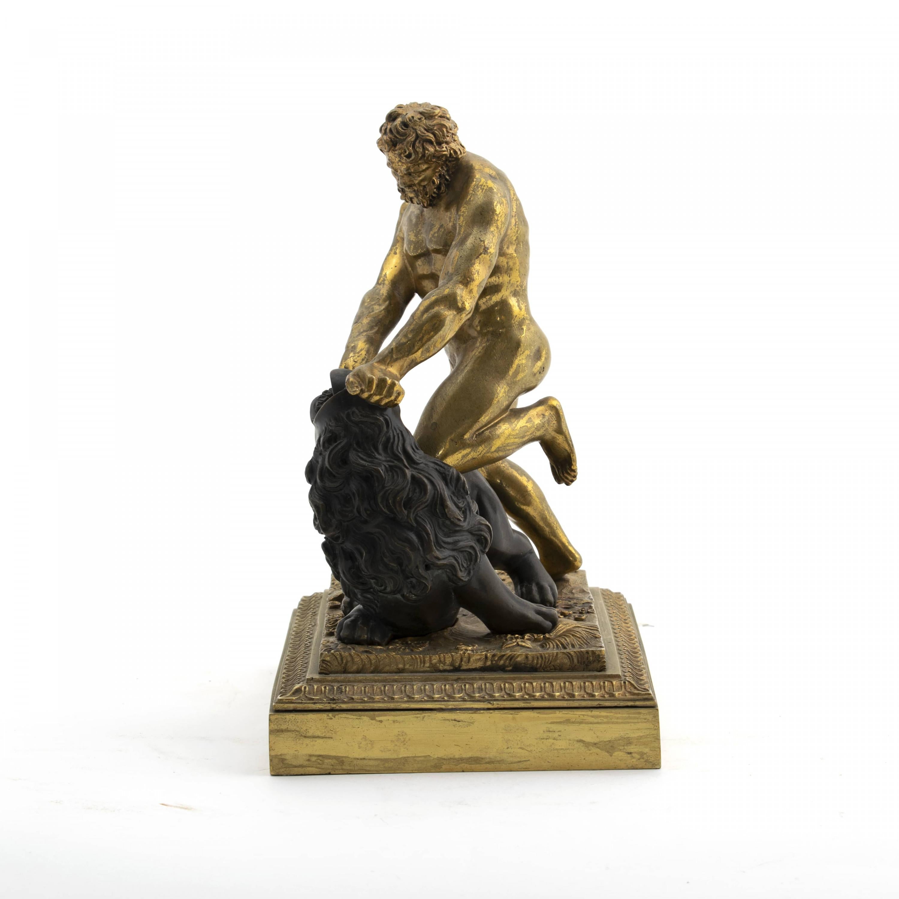 A Grand Tour bronze sculpture depicting Hercules (Herakles) fighting the Nemean Lion.
Gilt and patinated bronze.
Italy 1820-1830.

The Nemean lion that Heracles has to defeat in his first labour symbolizes victory over the ego, from habitual