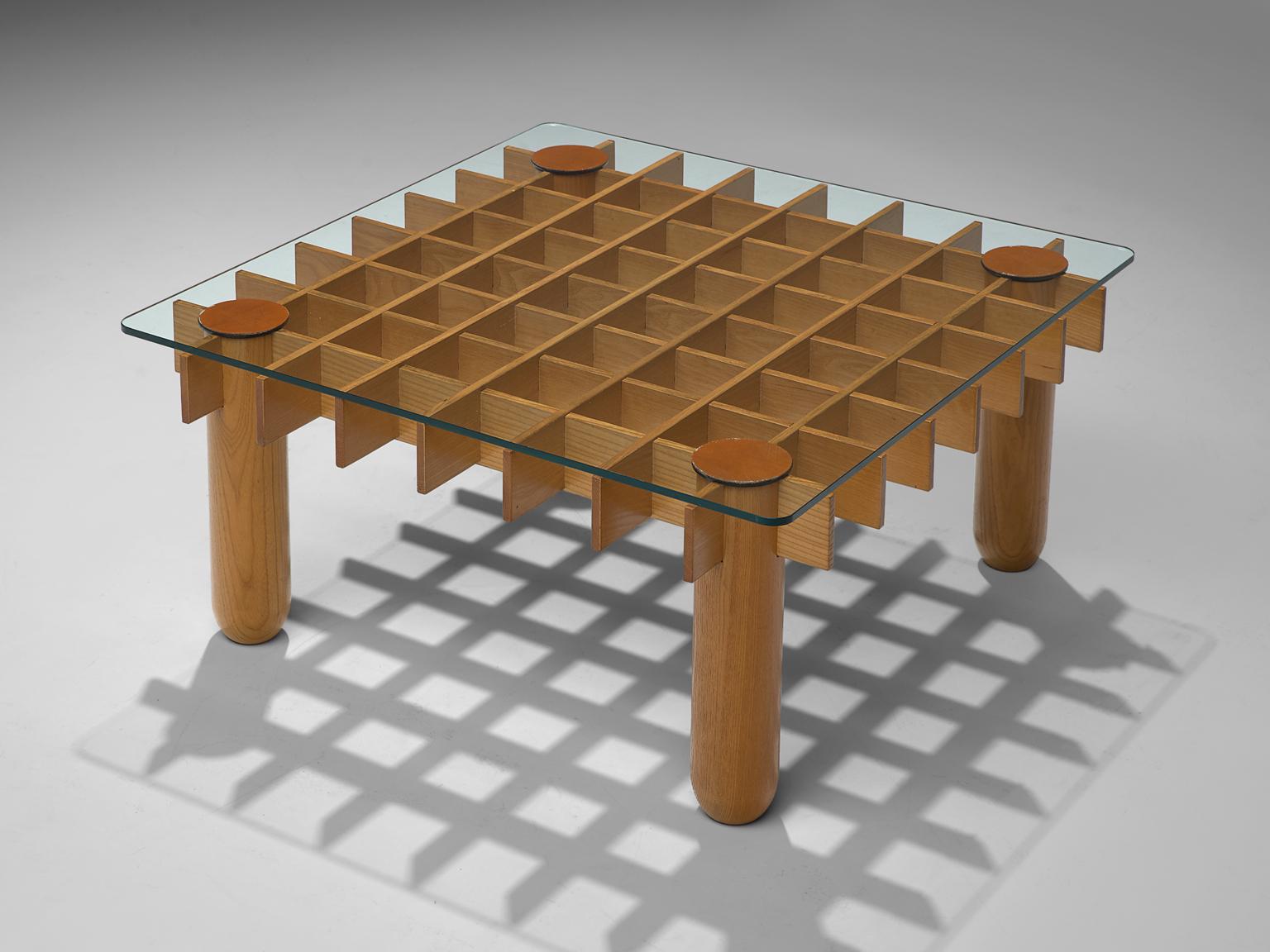 Coffee table, maple, leather, glass, Italy, 1970s. 

This blond maple coffee table from Italy consists of a wooden grid, build up out of maple laths. Four solid round legs end up in four round ends. On top of the grid rests a glass top. The