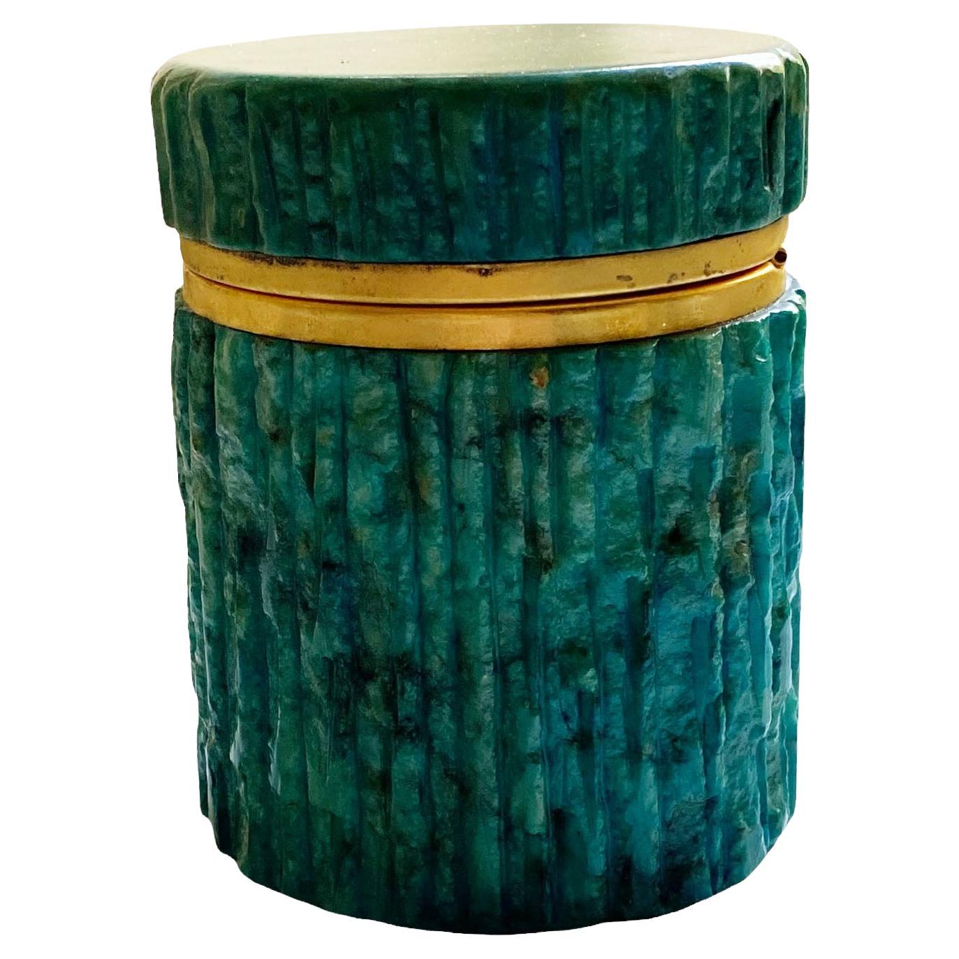 A beautiful deep green mid century alabaster box with hints of blue. With brass trim and a hinged top.