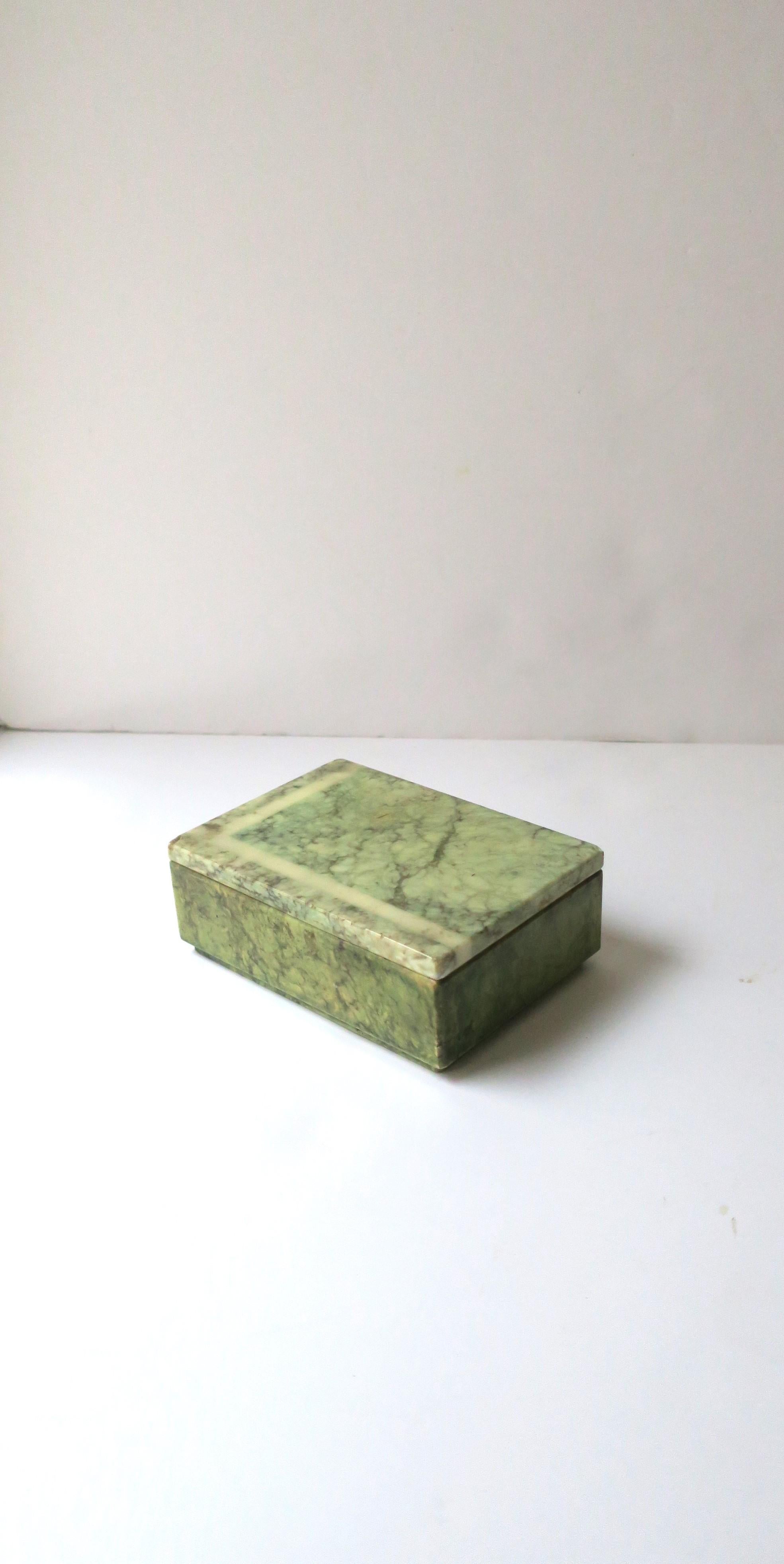 An Italian '70s modern green alabaster marble jewelry box, circa 1970s, Italy. Great as a standalone piece, for jewelry (as demonstrated), or other items on a nightstand table, vanity, console, desk, walk-in-closet, etc. Hues include greens, black,