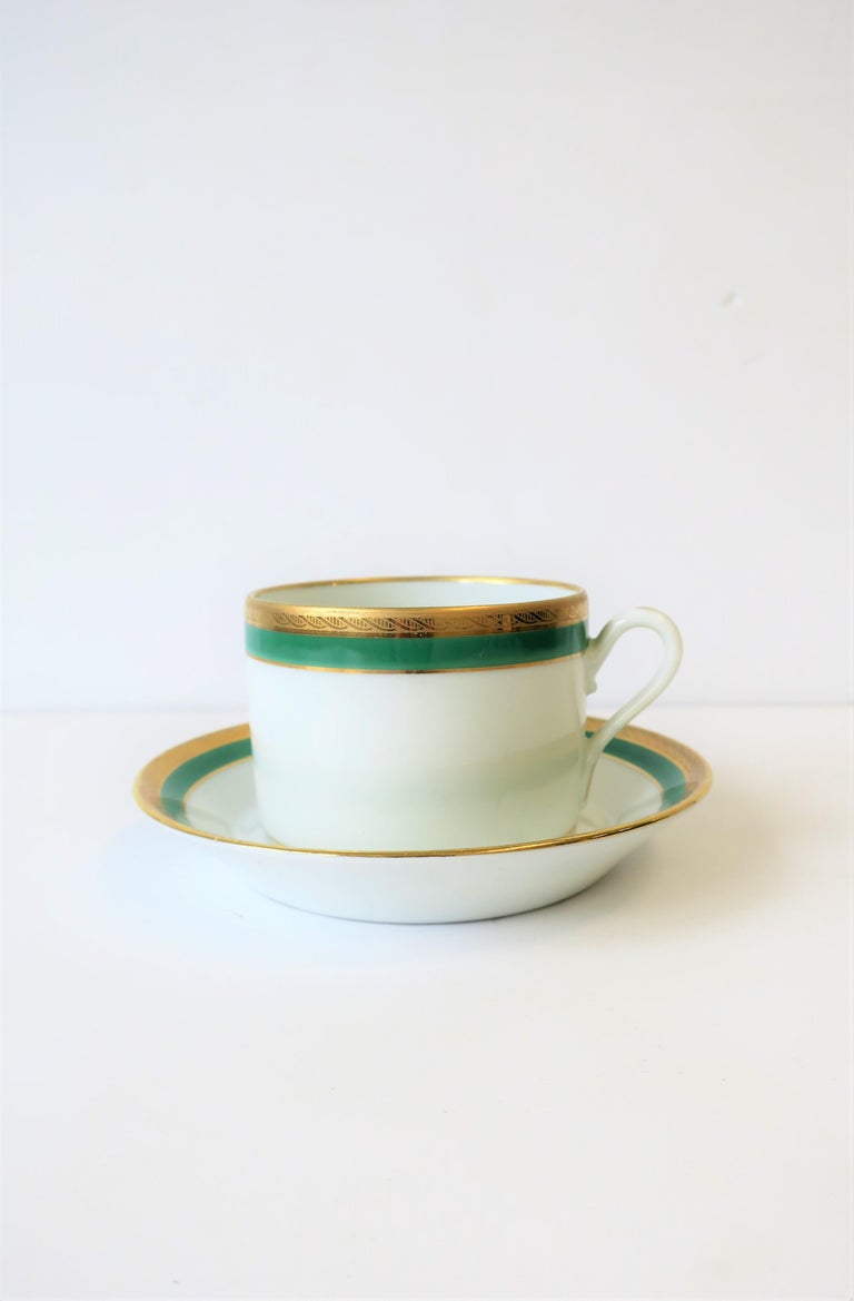 A very beautiful vintage century Italian white porcelain with emerald green and gold coffee or tea cup and saucer by designer Richard Ginori, circa 20th century, Italy. Colors include: Emerald green, gold and white porcelain. With maker's mark on