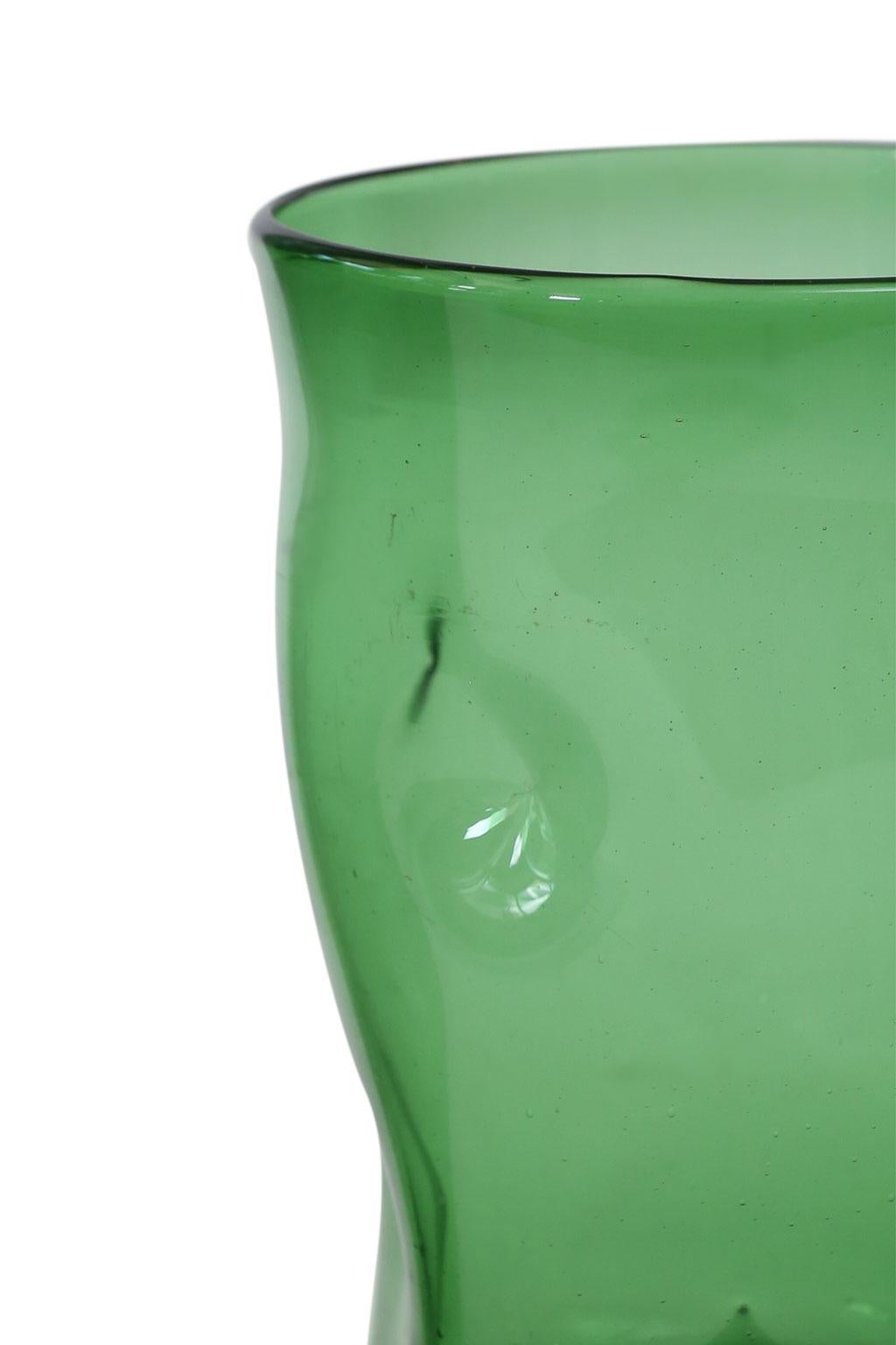 Italian green glass vase by Empoli, circa 1960. Vase’s surface is decorated in dimples.