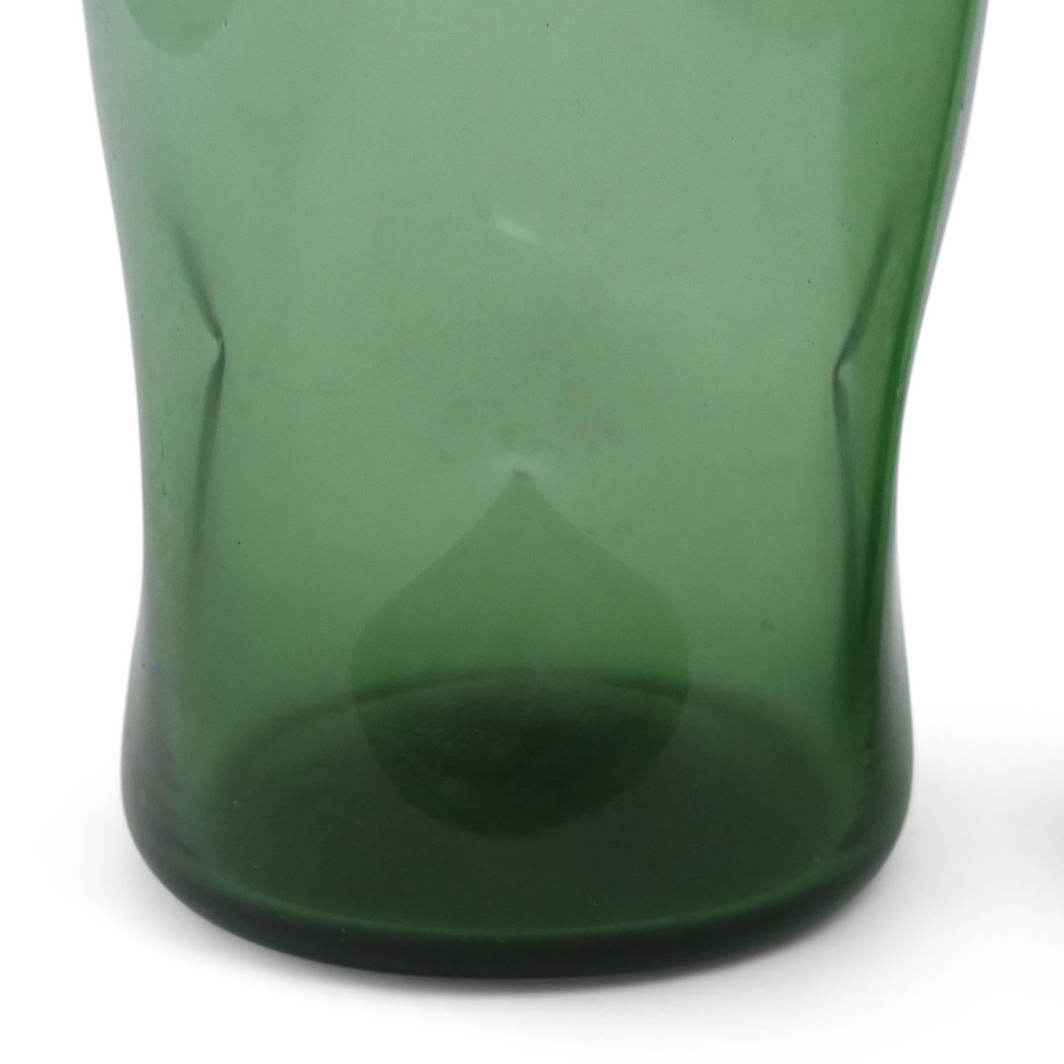 Italian green glass vase by Empoli, circa 1960. Vase’s surface is decorated in dimples.