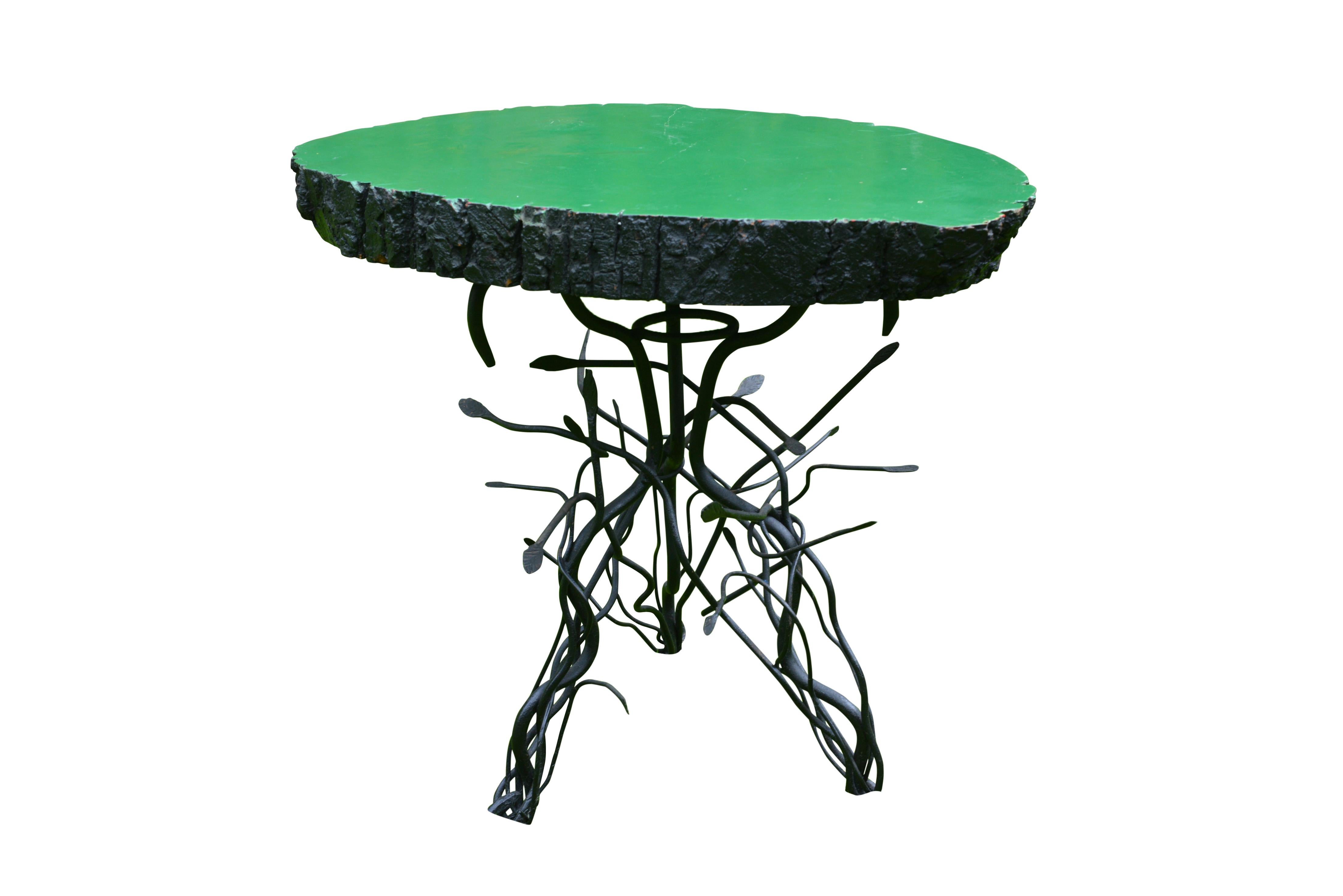 A quirky side table with Irish green lacquered tree-trunk top and twisted wire branches base.