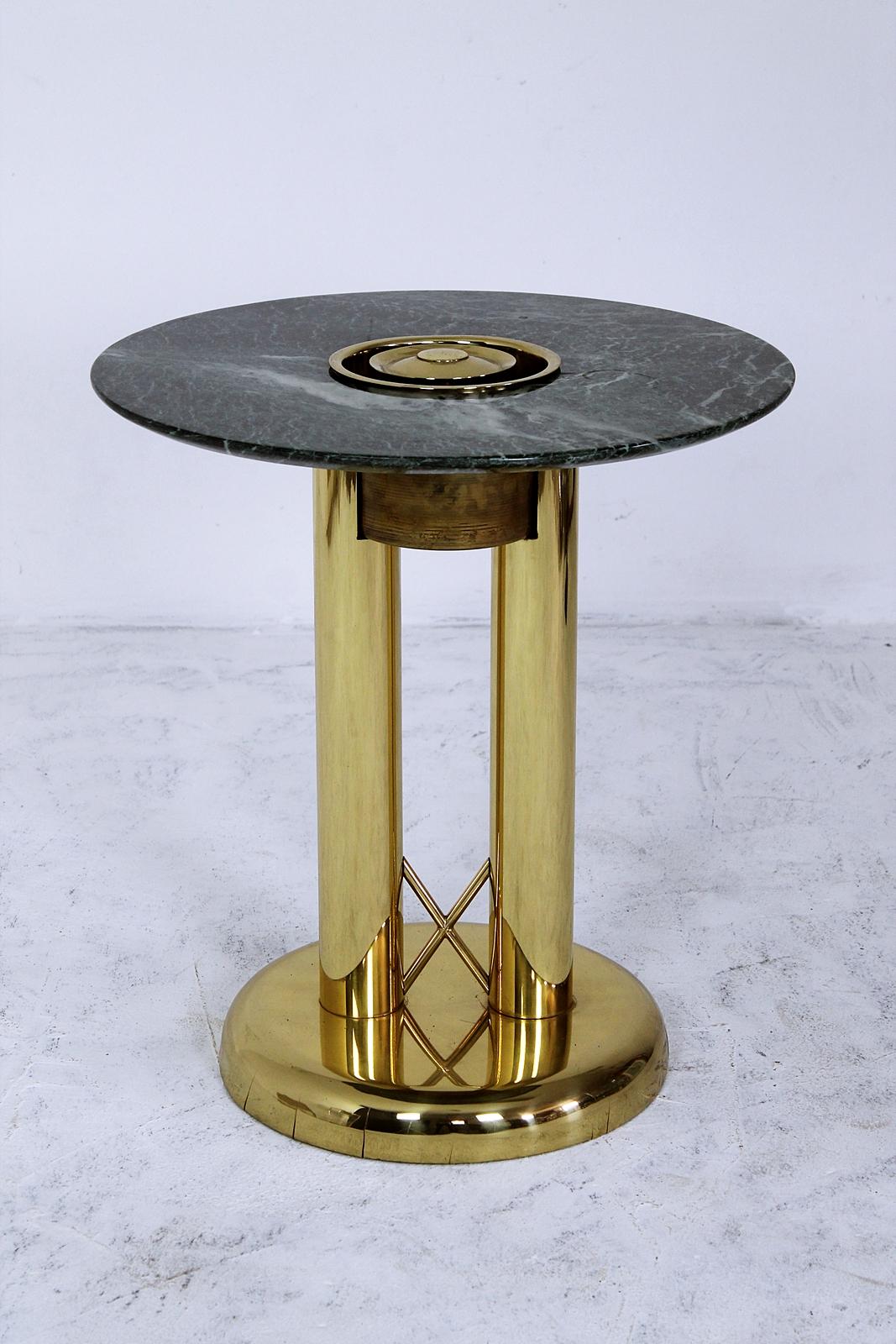 Fabulous 1980s brass side table with original green marble plate from Milan.
Good condition.