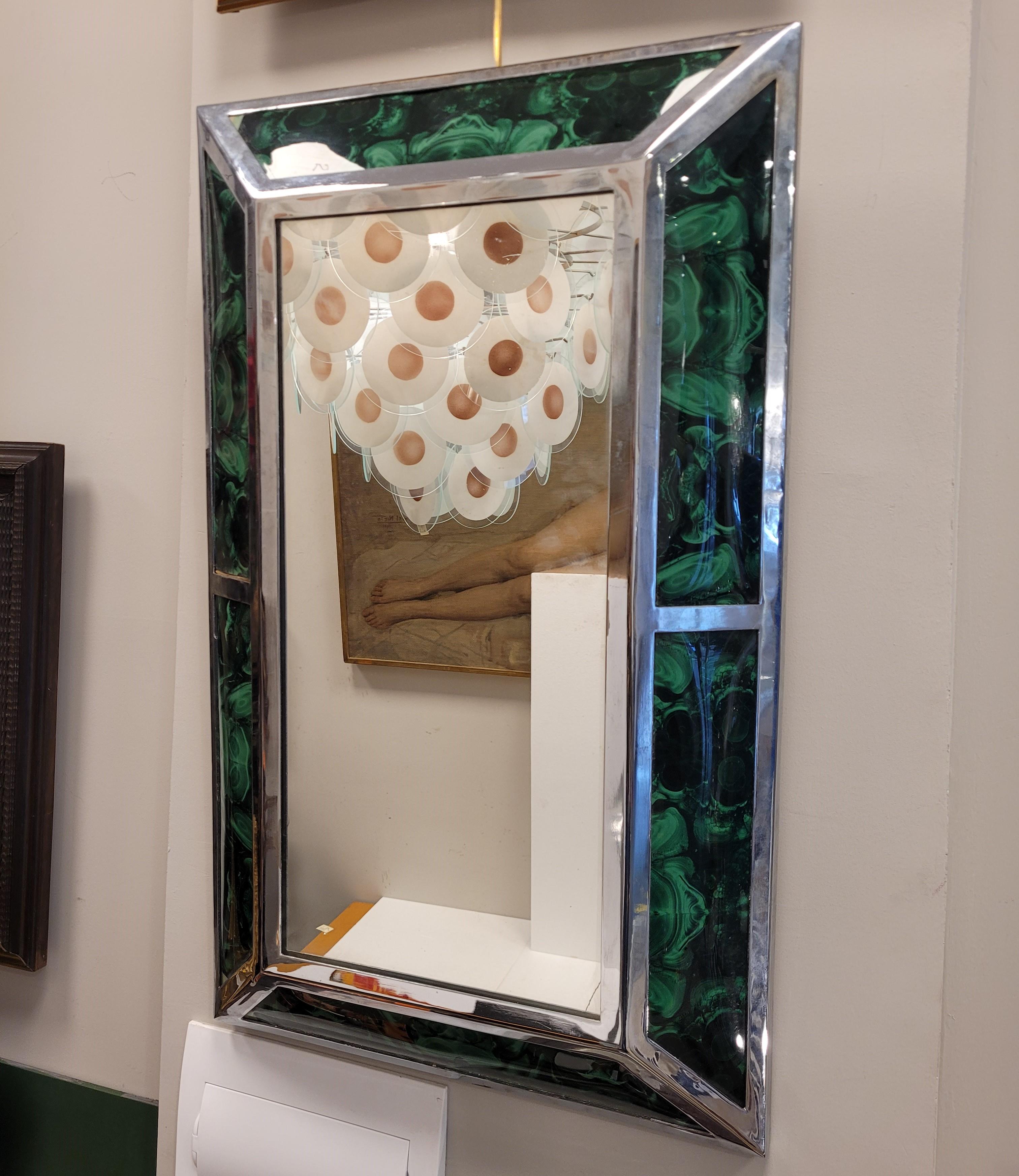 Beautiful Italian mirror in malachite effect fiberglass, rectangular profile with double chrome steel bezel.
Midcentury style and period, circa 1970. Following the decorative style of the renowned decorator and photographer Willy Rizzo.
A highly