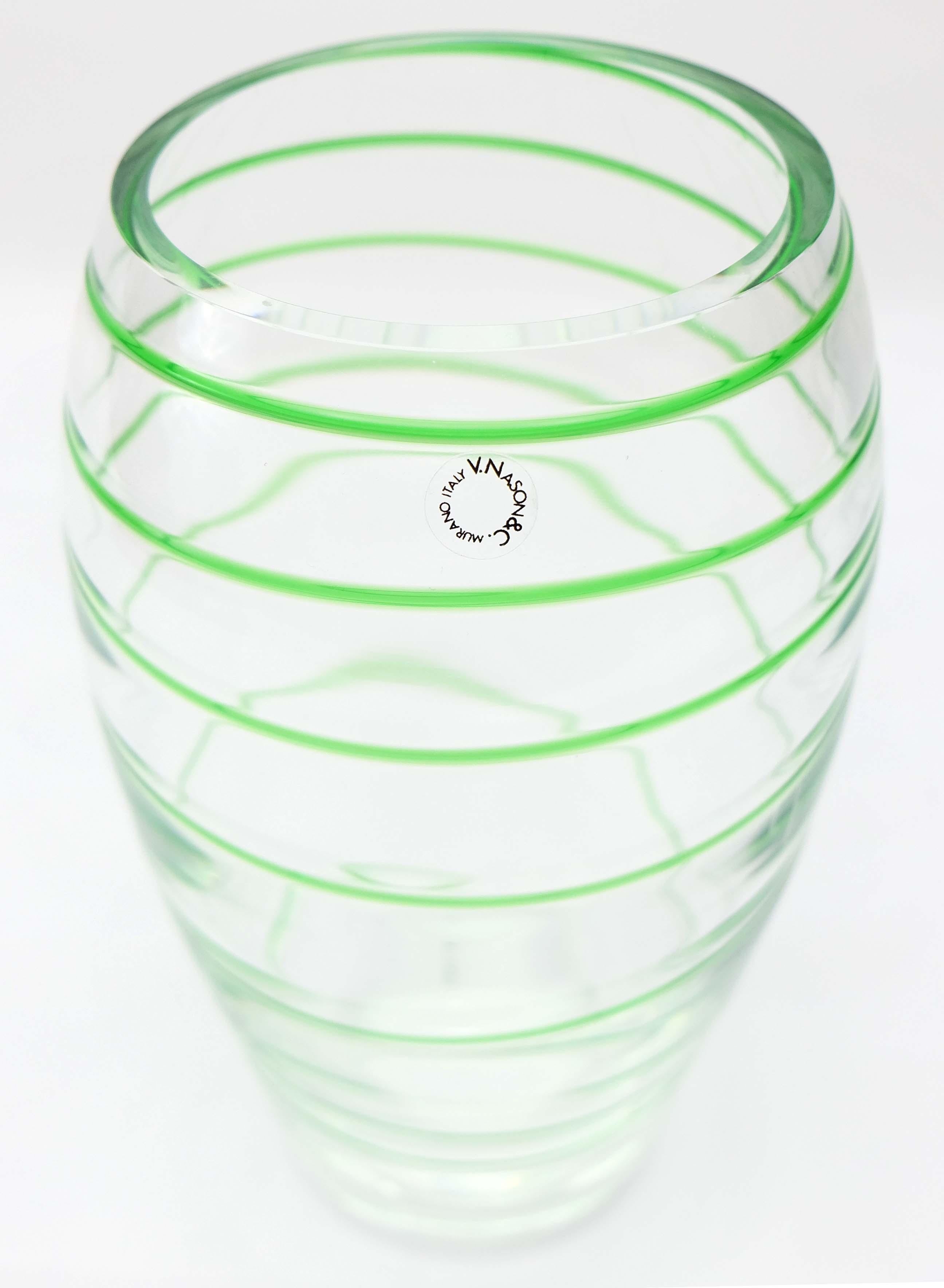 Murano Glass Vase by V. Nason & Co.Italy, Green Swirl Stripe

Offered for sale is an Italian green spiral stripe Murano glass vase by V. Nason & Co. This mouth-blown glass vase is in a transparent and green spiral color and retains the original