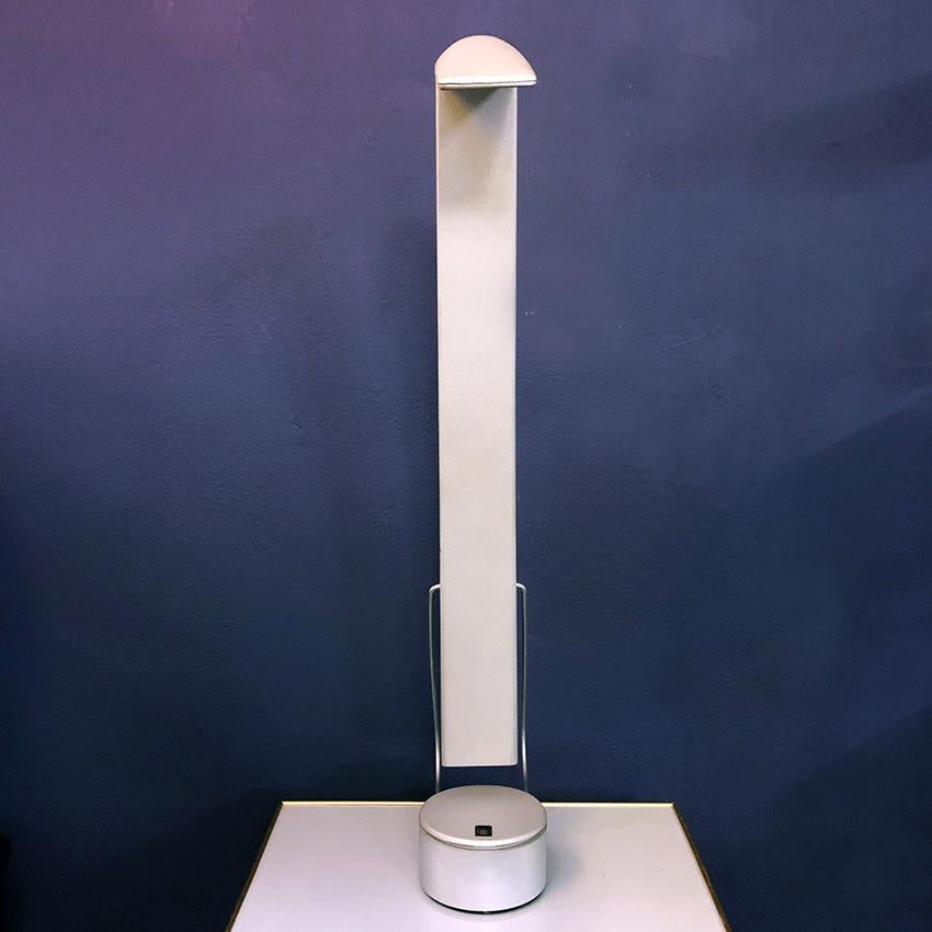 Italian grey plastic and metal adjustable table lamp, 1980s. 
Adjustable table lamp, with plastic structure and metal joints. 
Produced by Paf. 
In very good condition
This lamp can be used on a desk with 1980 style or in pair for a nightable
We