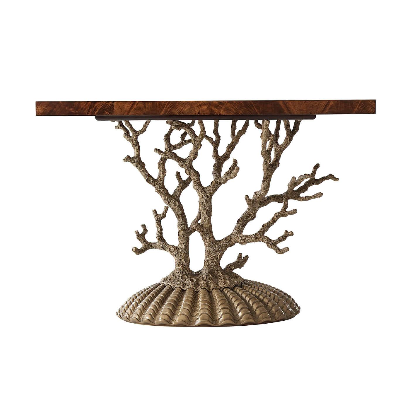 An unusual Grotto table, with a rectangular flame veneered mahogany top on a branching coral cast metal support and shell form cast metal base.

Dimensions: 48