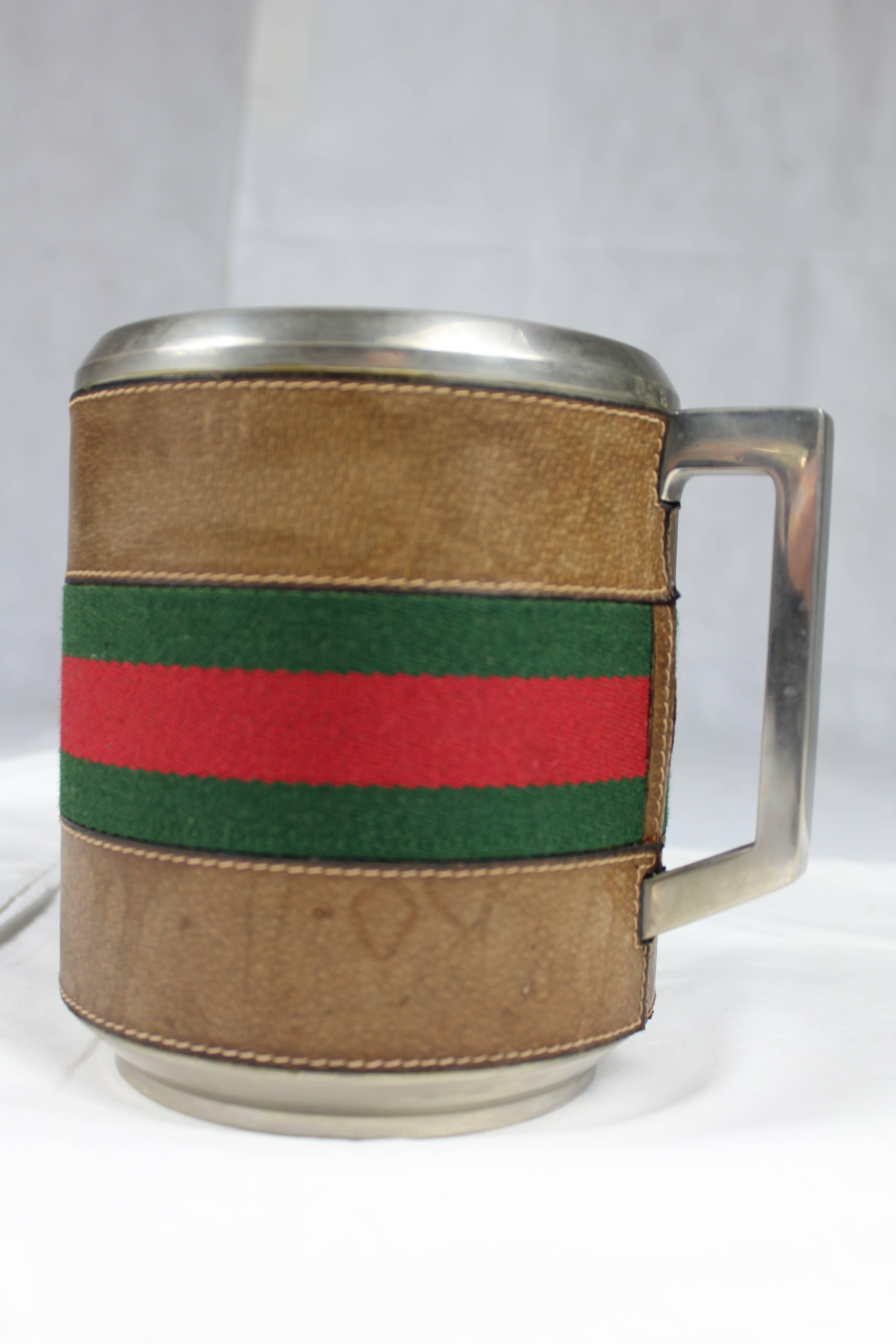 Ice bucket from Gucci circa 1970s, original leather and the typical Gucci stripe in green and red. Excellent conditions.
