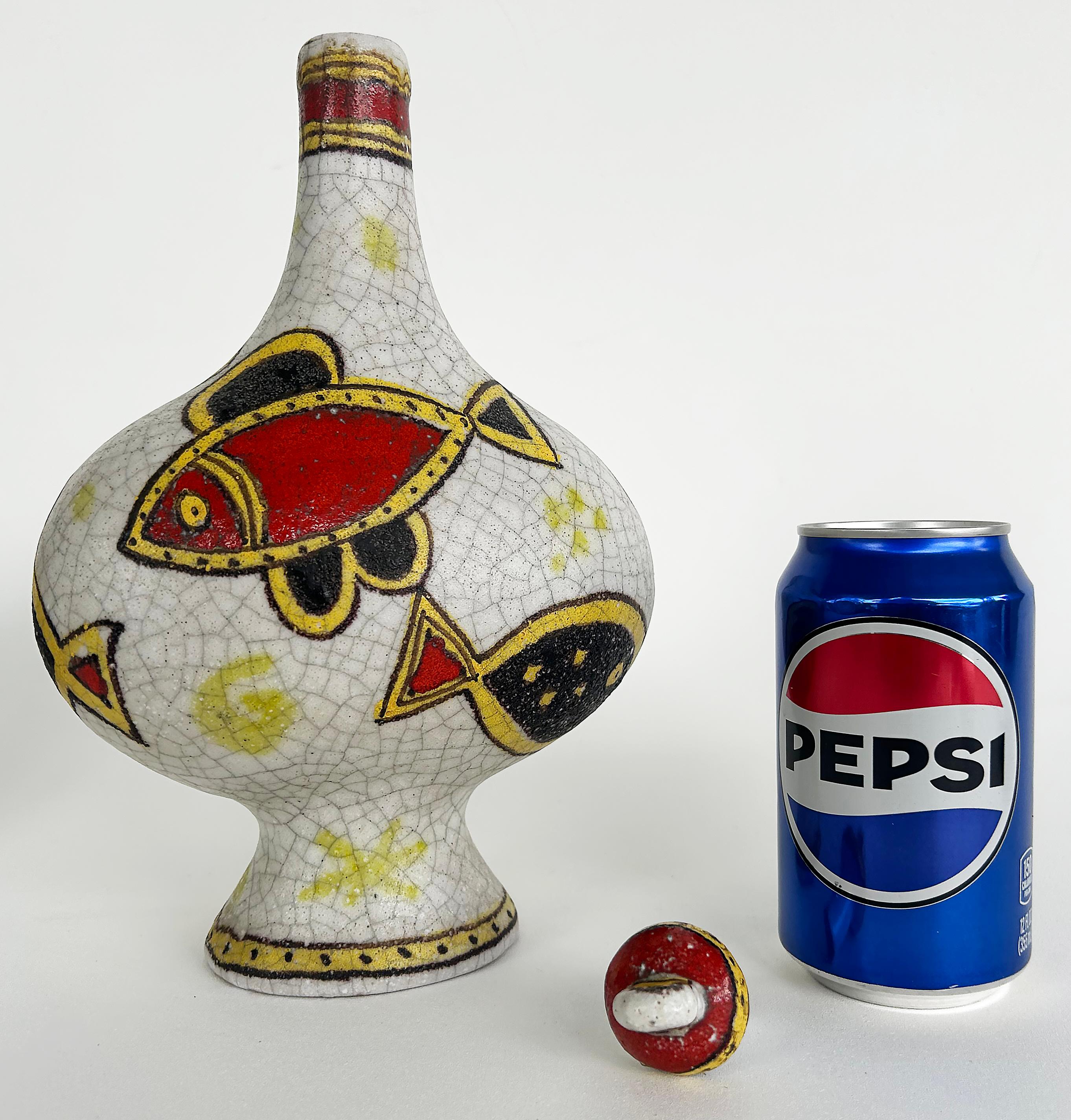 Italian Guido Gambone Glazed Ceramic Vessel with Stopper, Signed on Underside

Offered for sale is a mid-century modern Guido Gambone (1909 – 1969) glazed ceramic decanter with a stopper.  The piece is quite colorful and has a fish motif.  The base