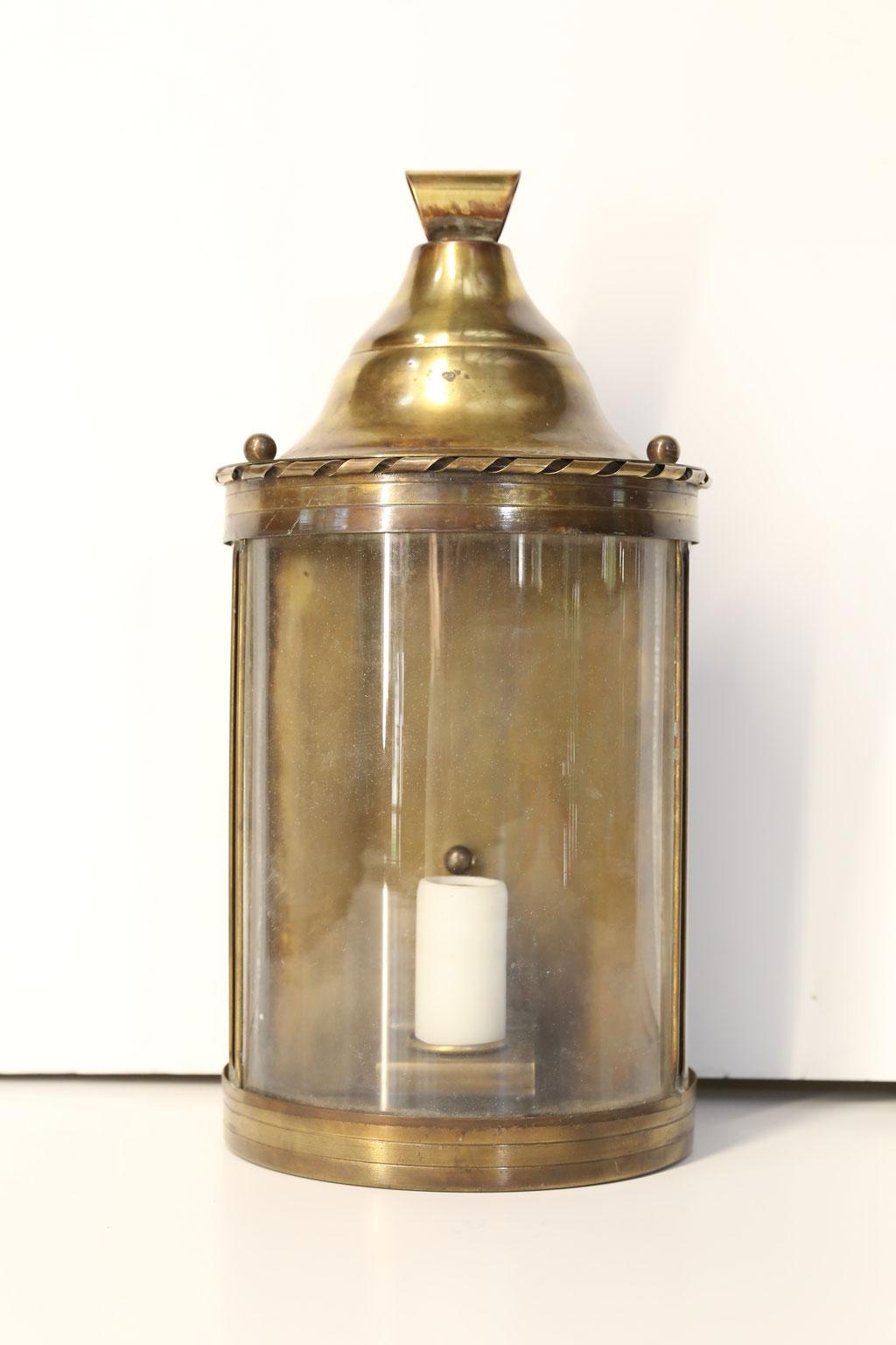 Italian hall lantern: wall-mounted lantern in raw brass. Newly wired for use within the USA using all UL listed parts.