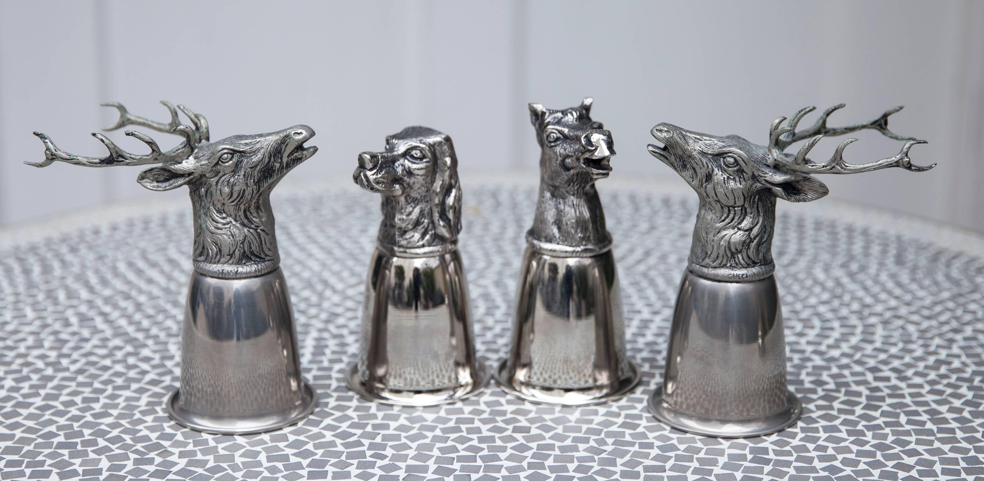 This four very Italian hallmarked Gucci silver plated stirrup cups have two ways.
They actually flip over and can be used as barware and be conversational at dinner parties. Excellent vintage condition. All marked Gucci.
Deer head stirrup cups