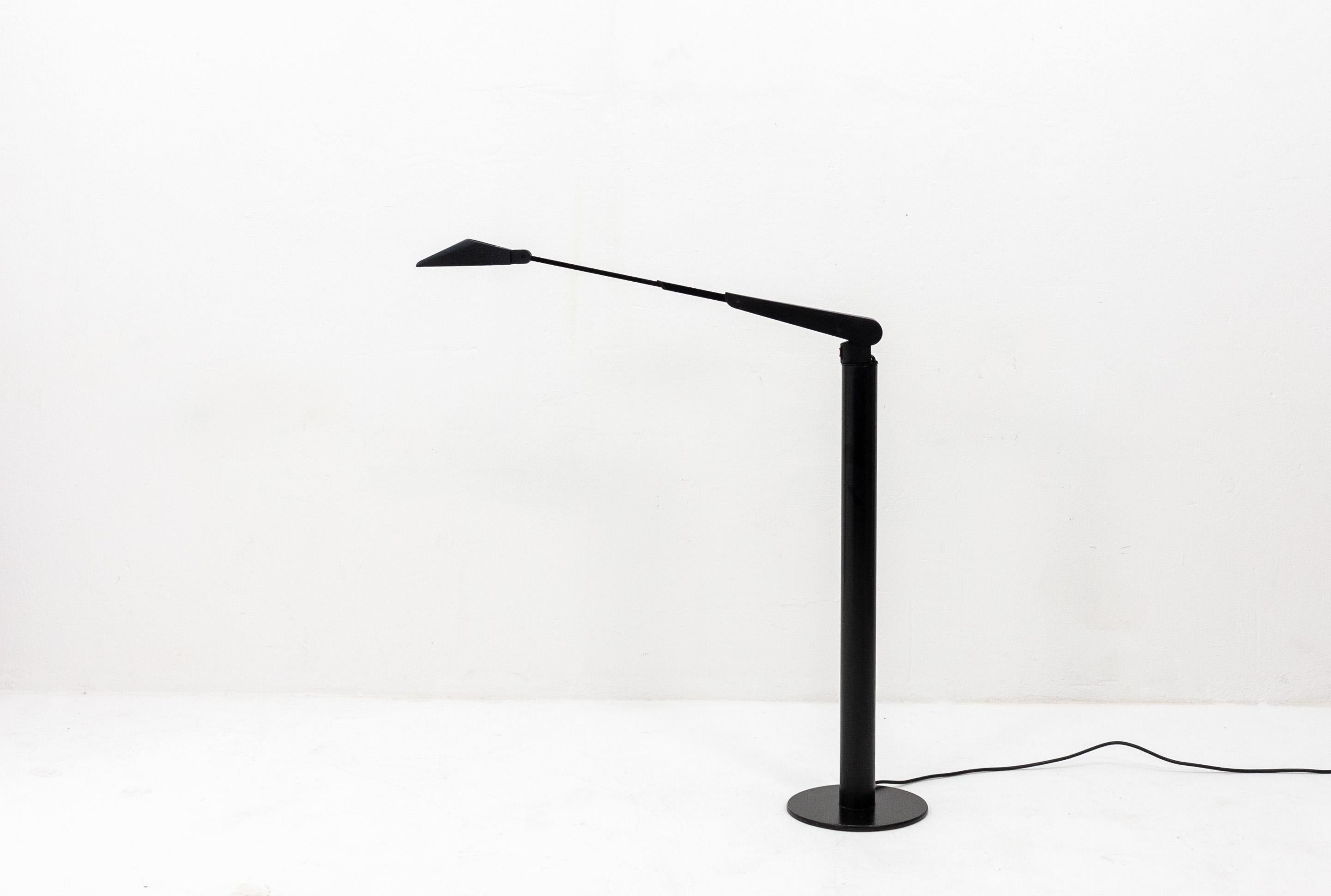 1980s floor lamp inspired by manufacturing robot arms. Featuring a two-stage dimmer and a telescoping upper arm. The light can fully rotate on its arm making it very flexible.
 