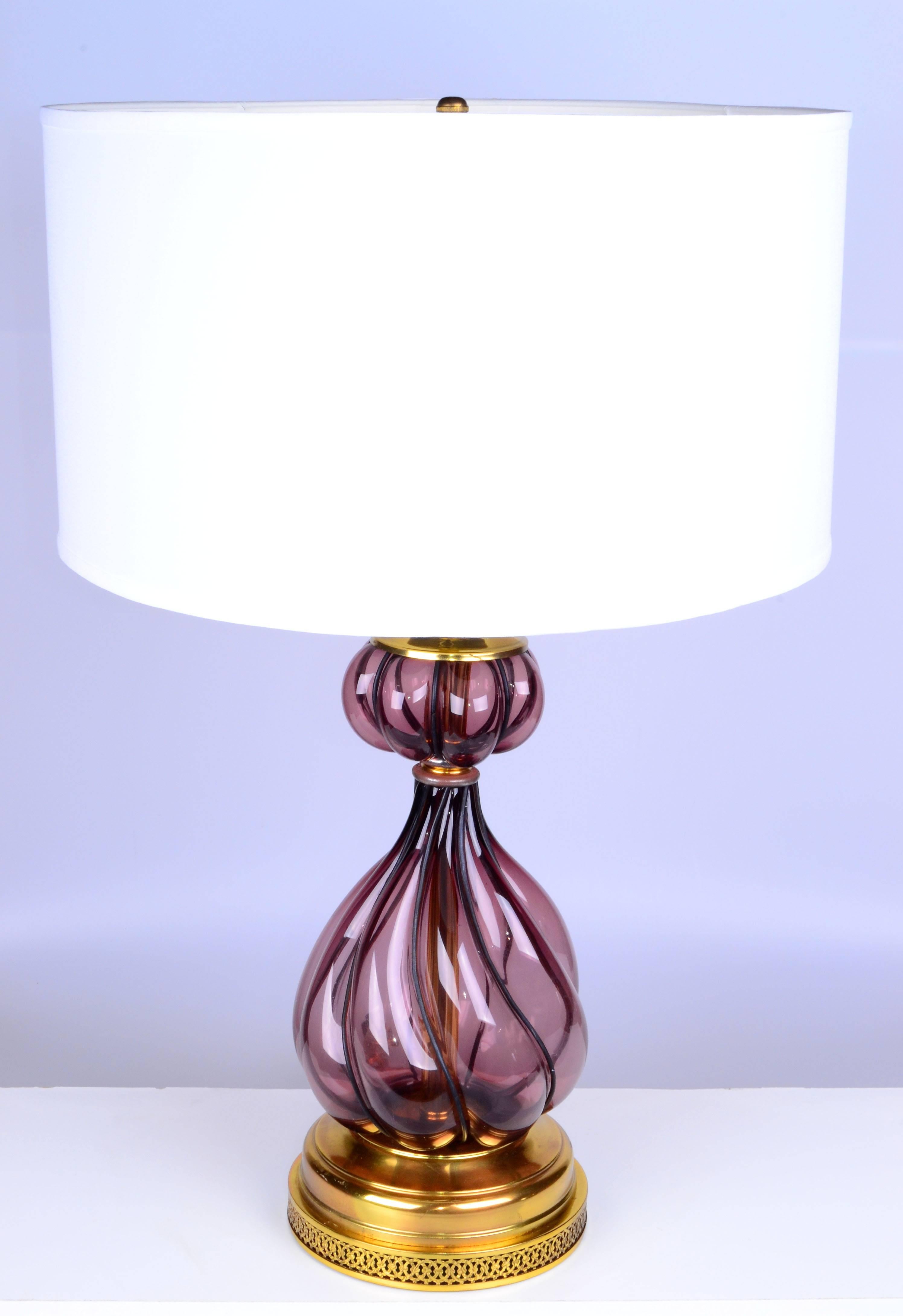 Offered is an Italian blown purple art glass table lamp in a metal frame.
Wired for the U.S. and in working condition takes a regular or LED light bulb.
Harp, finial, and shade not included. No maker's mark.