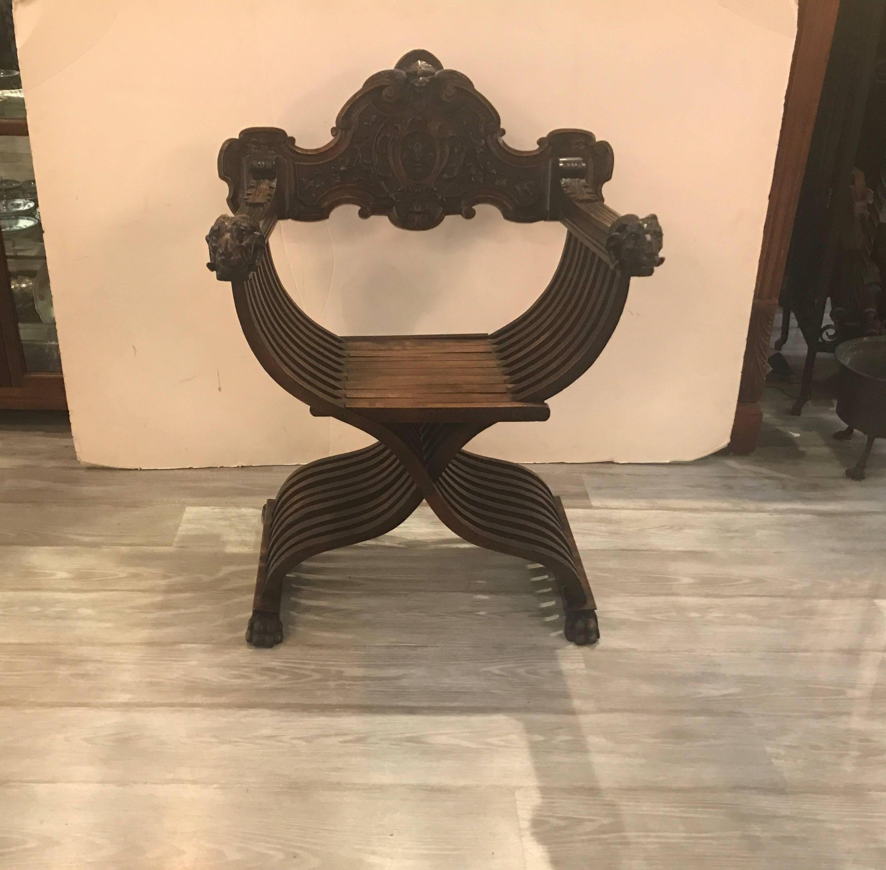 Hand carved walnut Savonarola chair. The rich walnut with warm aged patination and original well carved for finish. The carving on this example is exception with the highly detailed back and ram's head on the arms.
Developed in the late 15th