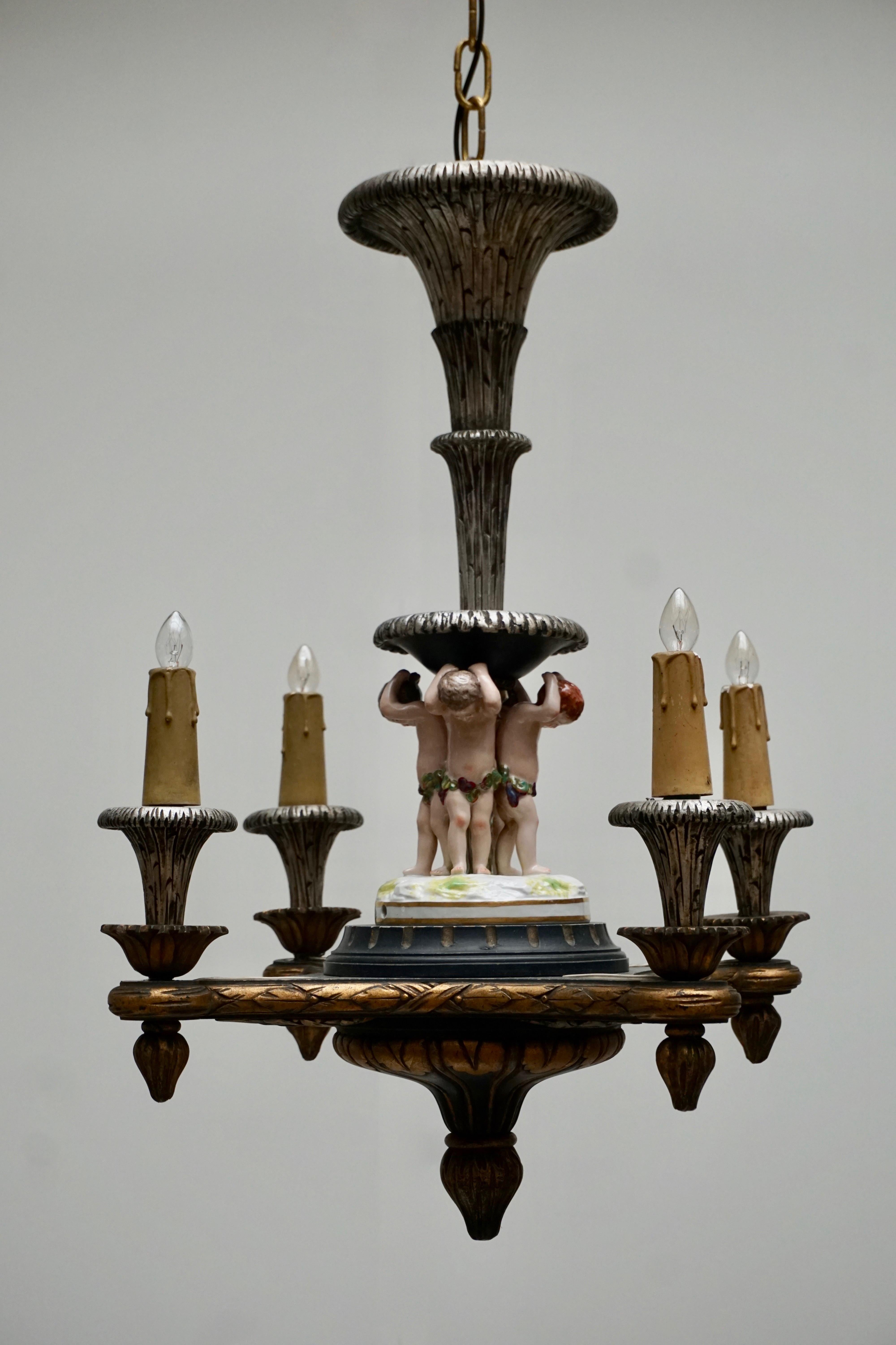 Gilt Italian Hand-Carved Chandelier with Porcelain Putti For Sale