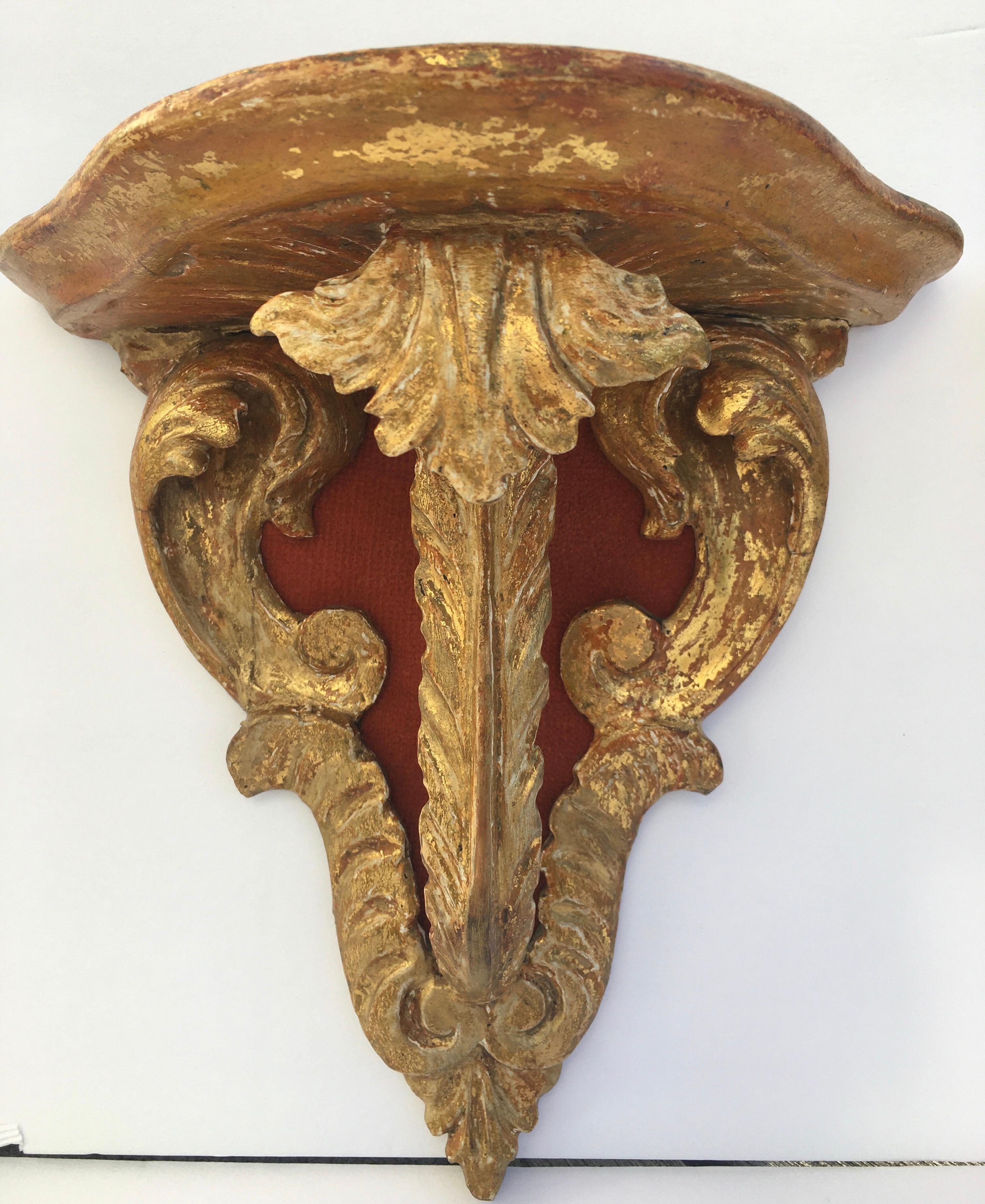 Pair of beautifully hand carved Italian giltwood wall brackets. Velvet backing added at a later date and can easily be removed.