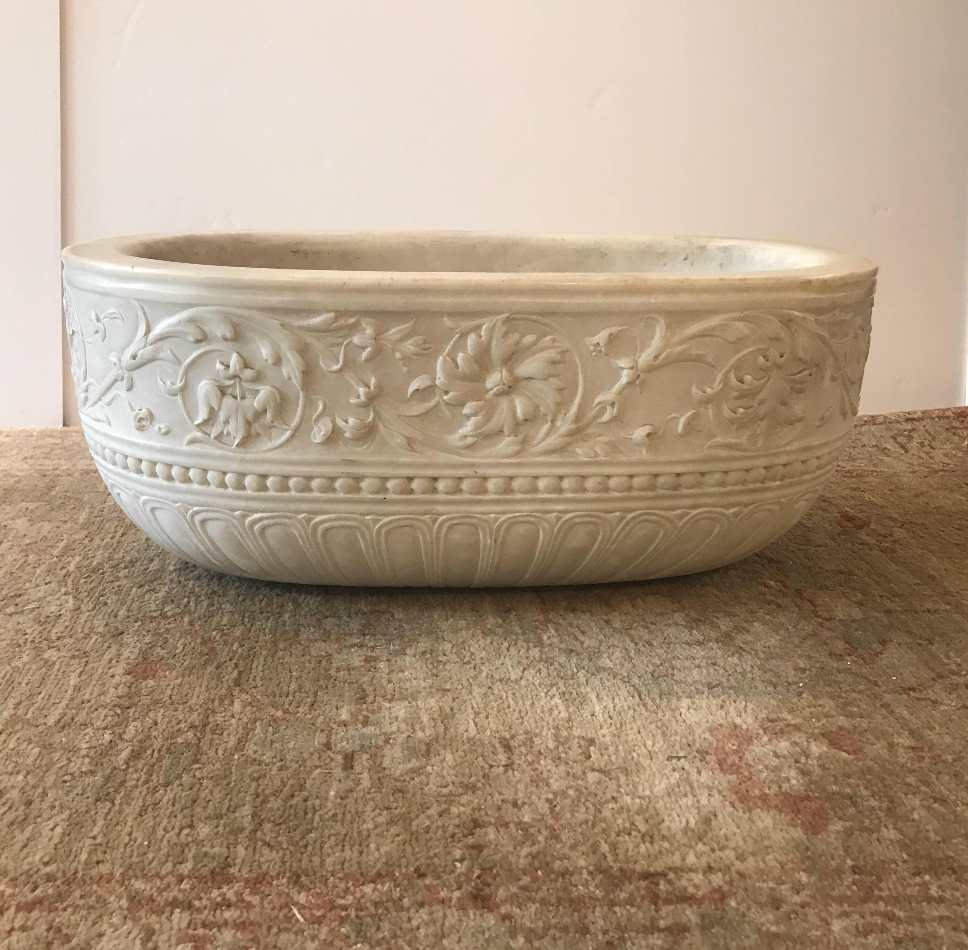 Unique one of a kind hand-carved marble basin, sink, fountain. This oval basin is carved in a Venetian style on the outside with beading borders and scrolling foliate pattern. The interior is drilled with a drain hole for a sink or a line to