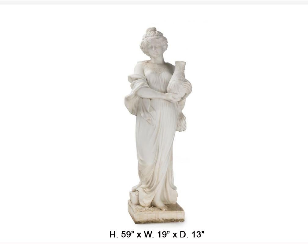 Life-size gorgeous Italian beautifully hand carved white marble sculpture of a standing maiden dressed in Classical robes holding a jug of water, raised on a naturalistic square plinth. 
First half of the 20th century. 
The impression of the face