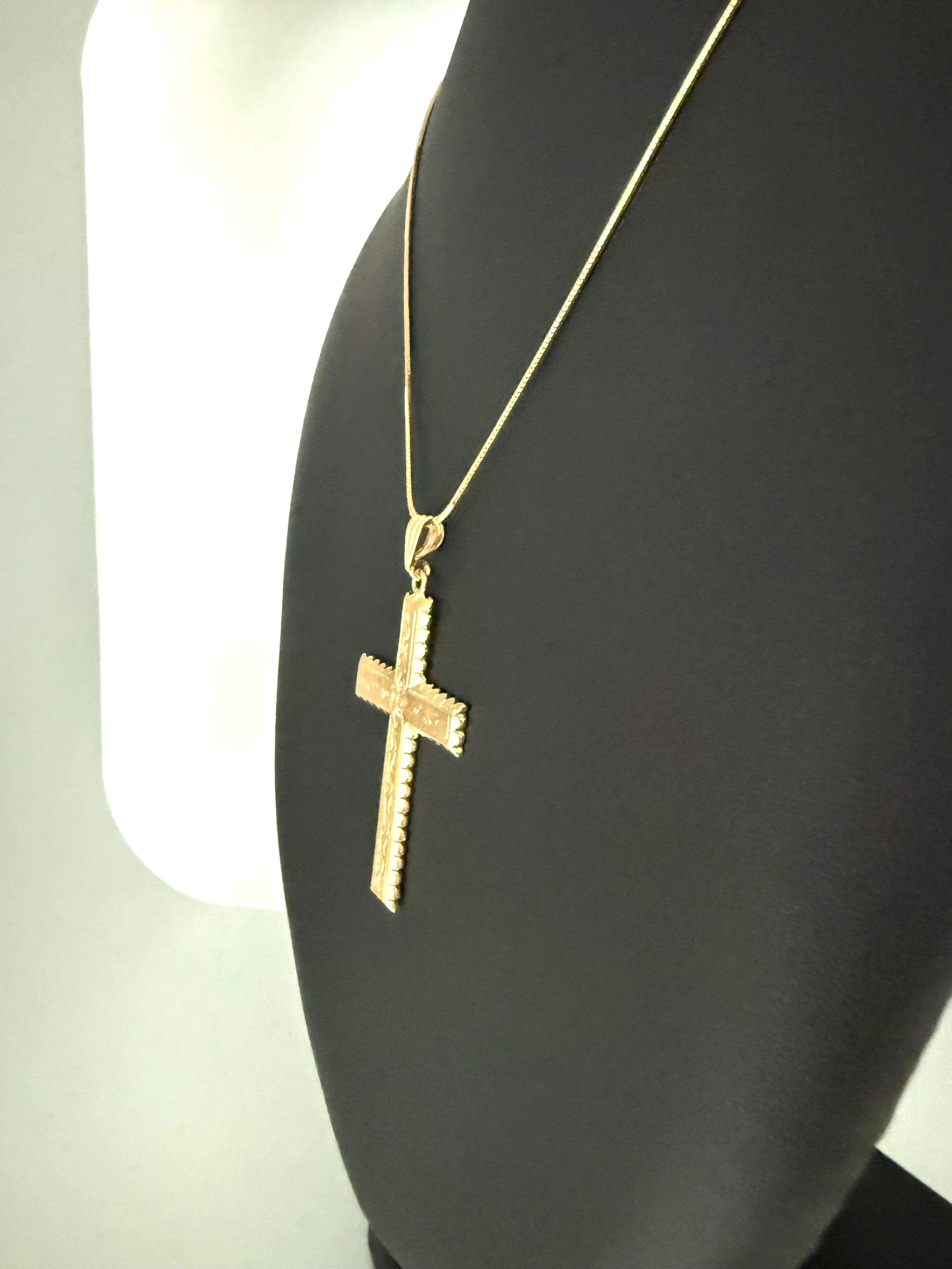 This Italian Hand-Carved 18kt Yellow Gold Cross is a breathtaking example of masterful craftsmanship, combining intricate detailing with timeless elegance. Expertly handcrafted, this cross features delicate floral motifs, each petal and leaf