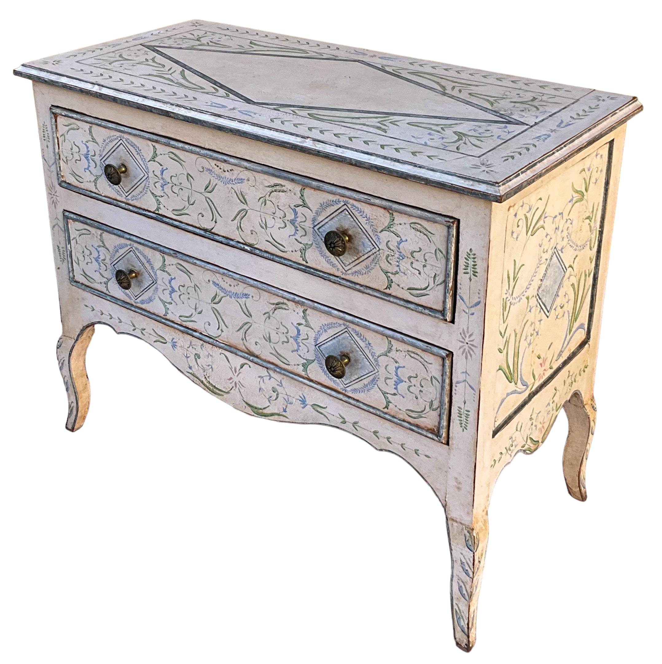This is a hand painted Italian commode with lovely Gustavian styling.  It is intentionally and heavily distressed. The drawers are paper lined.  I believe it to be a good reproduction and possibly by Niermann Weeks.