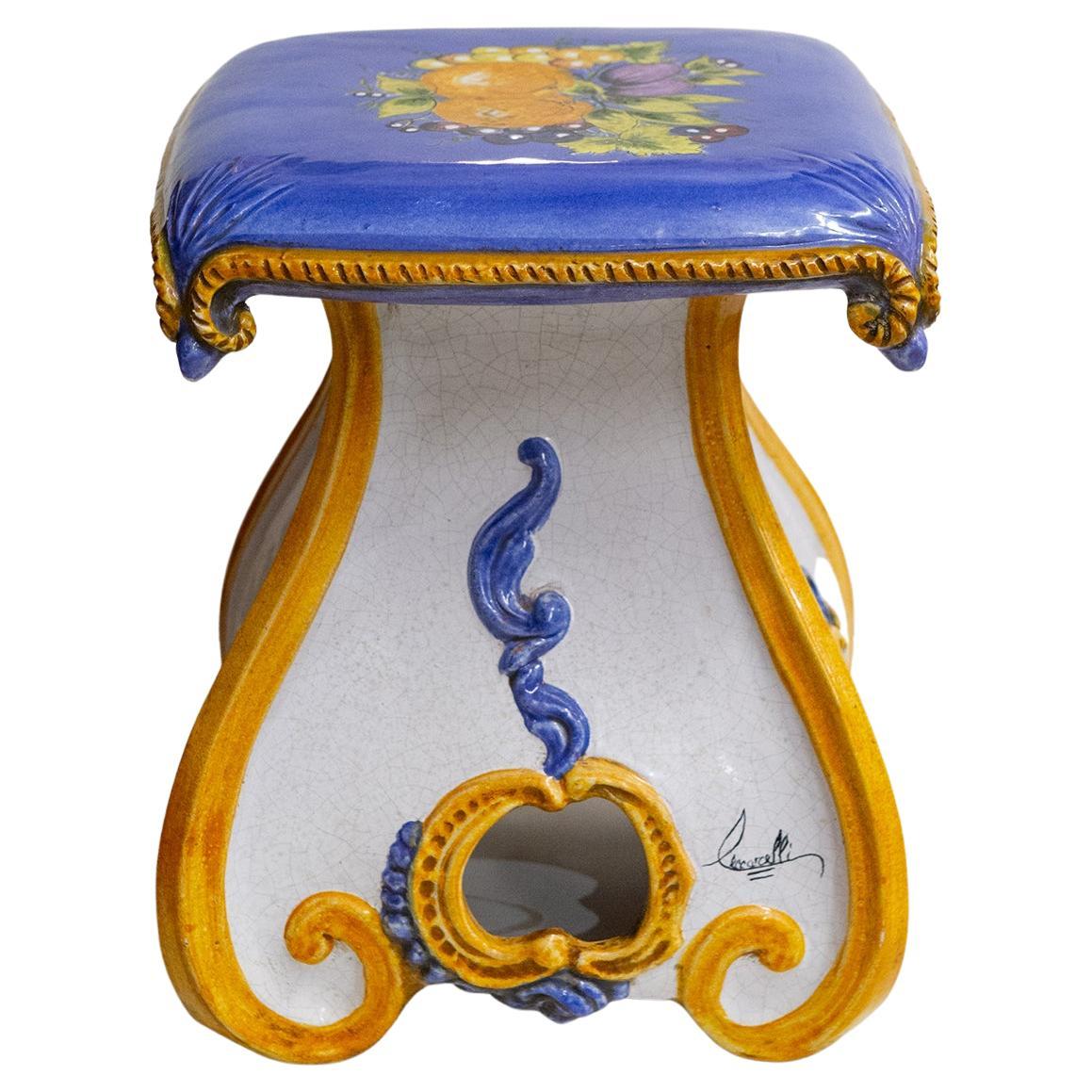 Tuscan clay stool, nice hand-painted. An idea of an Italian garden even in a city apartment: at the entrance it welcomes You with its colors, in the living room You can put down Your glasses and a book. With its colors it remember You the Italian