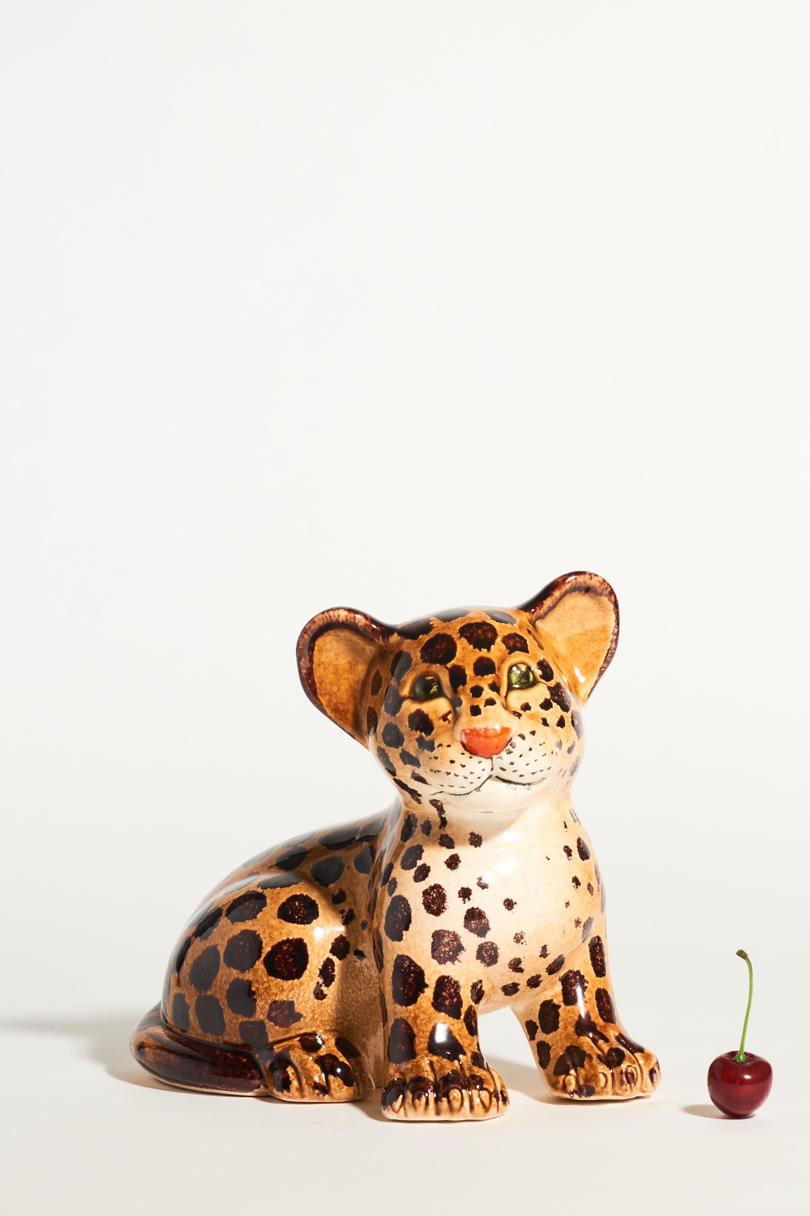 Italian ceramic hand painted leopard cub with sweet expressive face and lovely warm glazed colors.